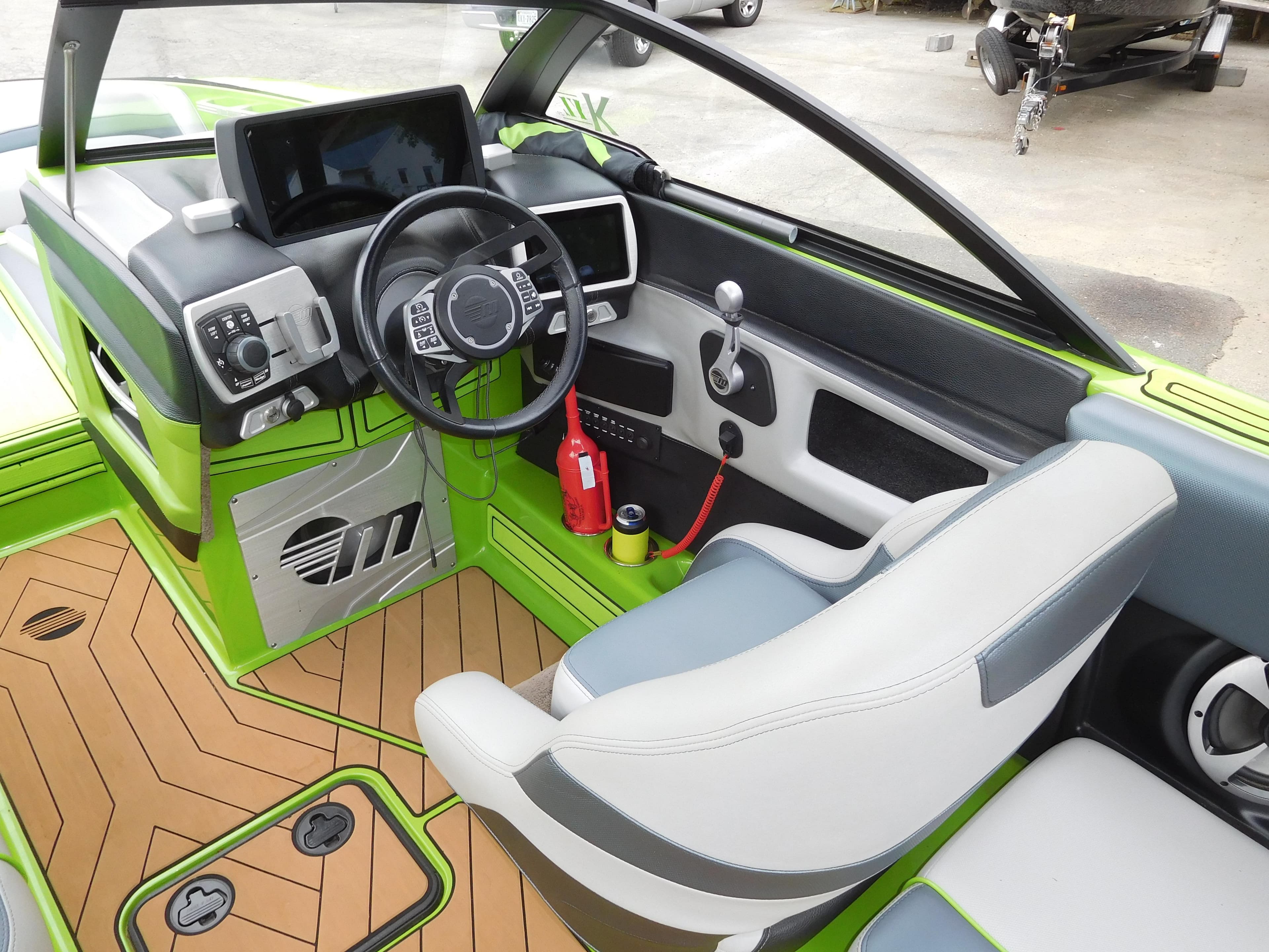 2017 Malibu Wakesetter 24 MXZ boat interior with steering wheel and dashboard.