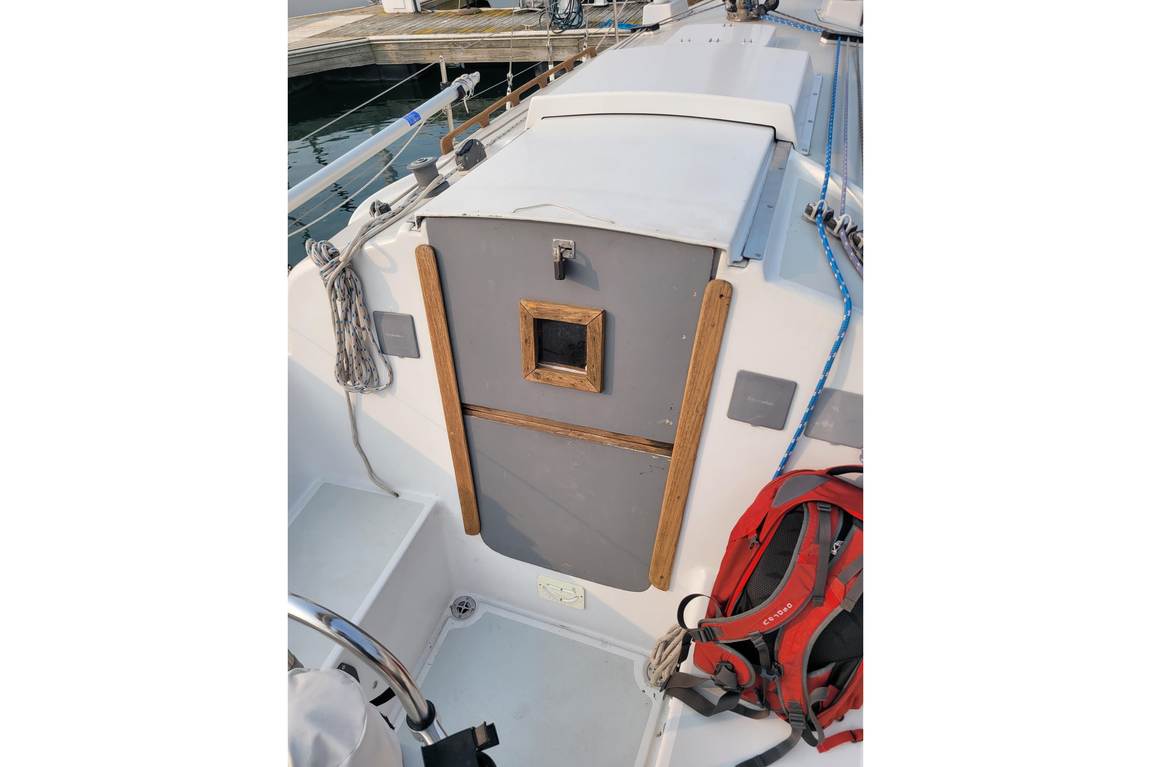 1971 Pearson 33 sailboat cockpit with wooden accents and nautical equipment.
