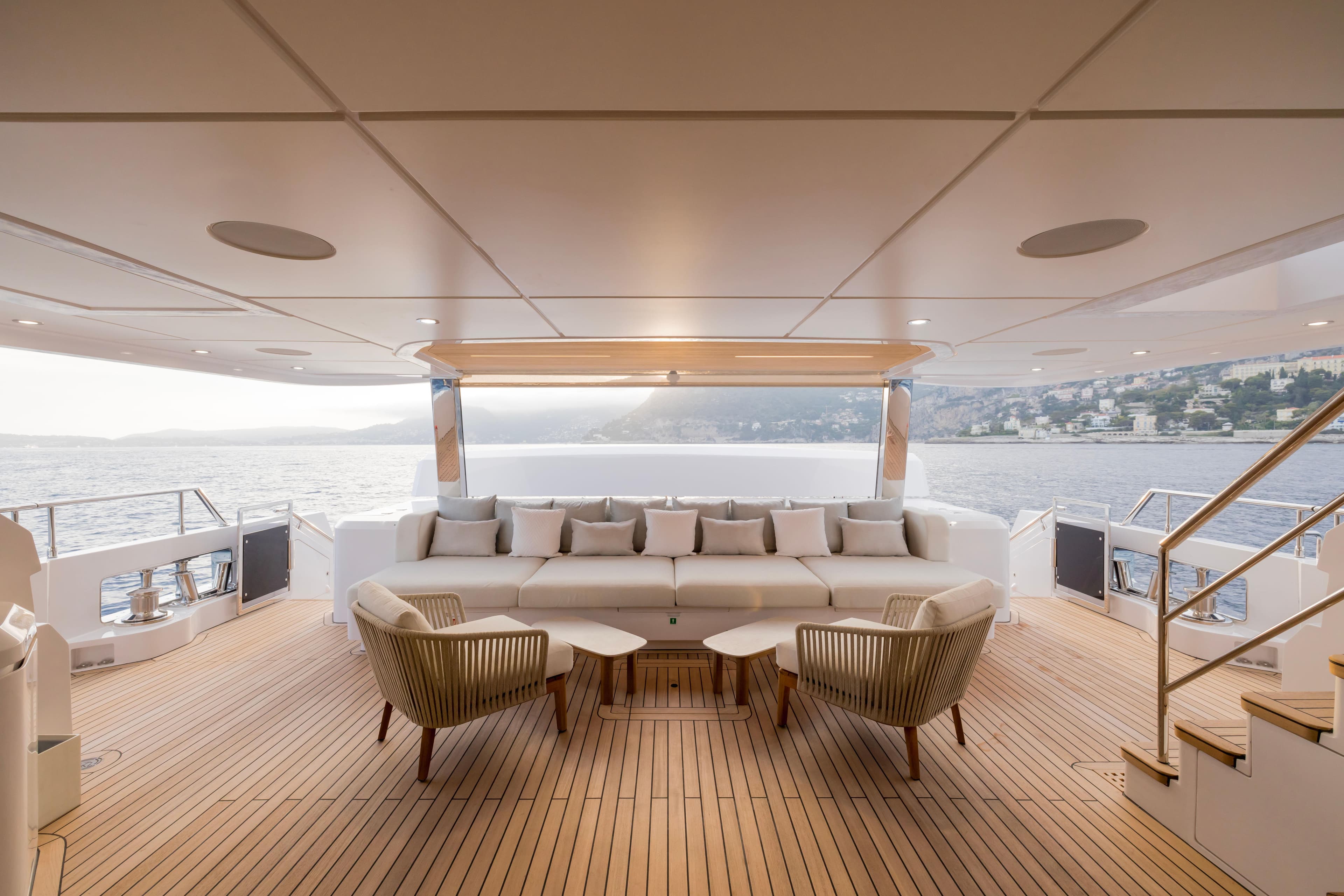Luxurious 2025 Majesty 120 yacht deck with elegant seating and scenic ocean view.