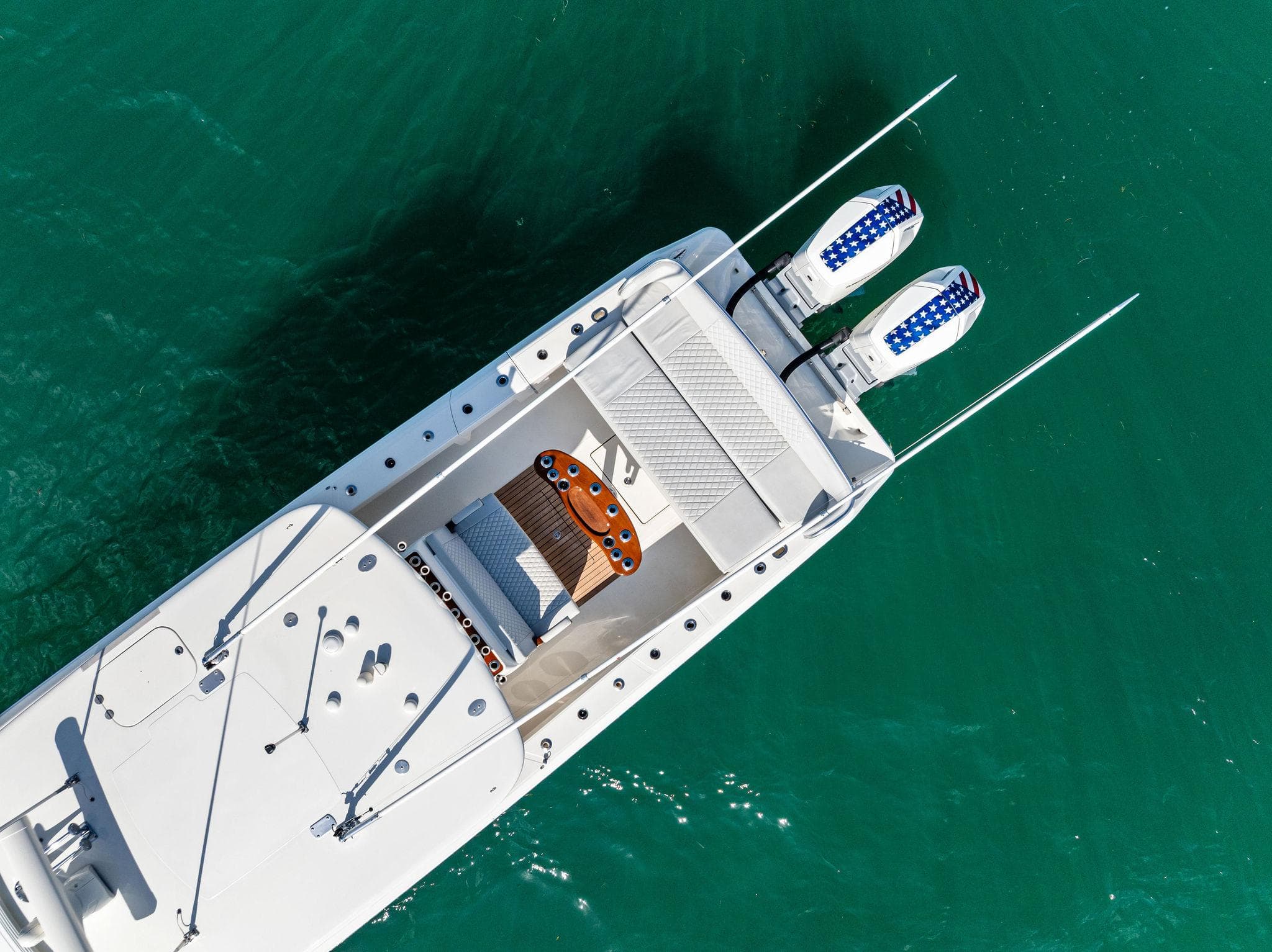 Aerial view of 2015 Bahama Center Console boat on turquoise water.