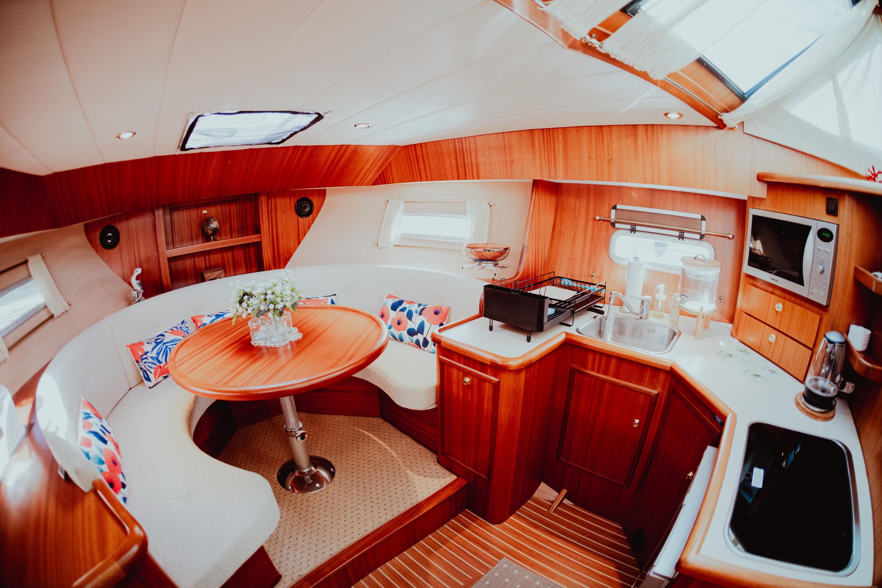 Luxurious interior of 2008 Boarncruiser 365 New Line yacht with modern kitchen and dining area.