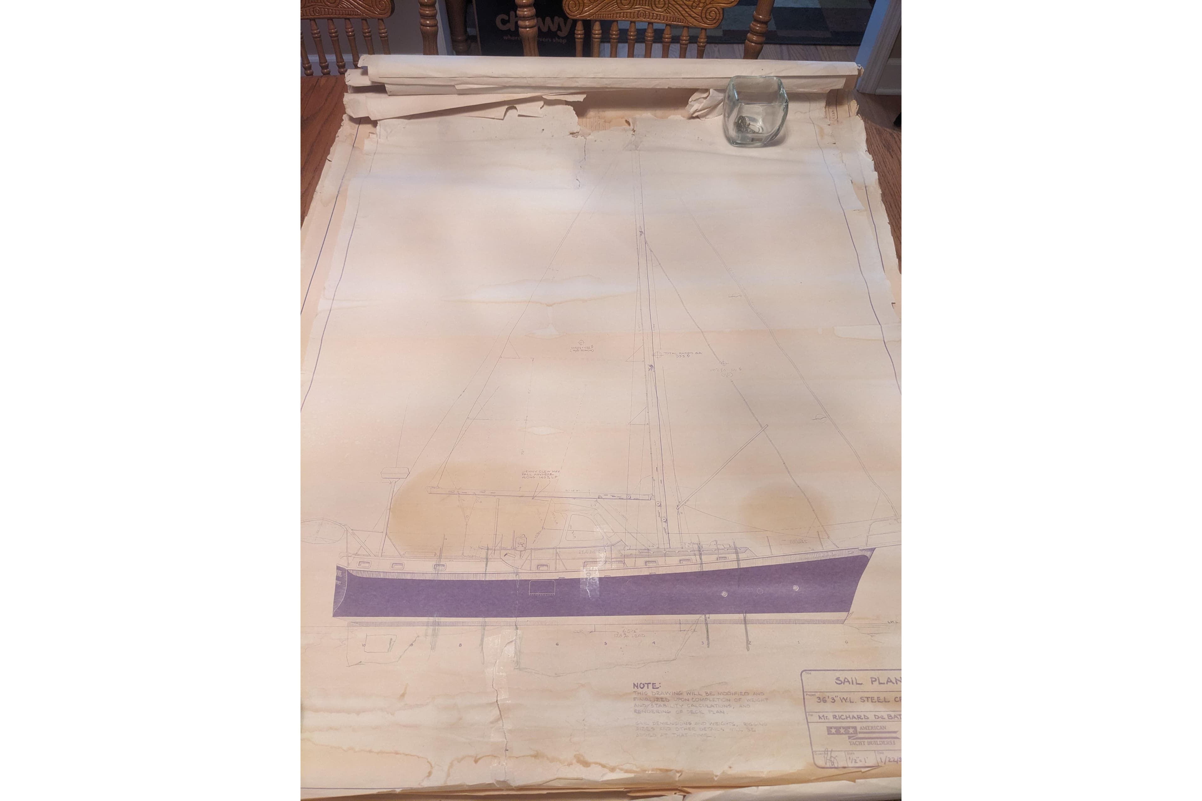 Blueprint of 1992 Bruce Bingham Custom 47 Steel Hull sailboat on table.