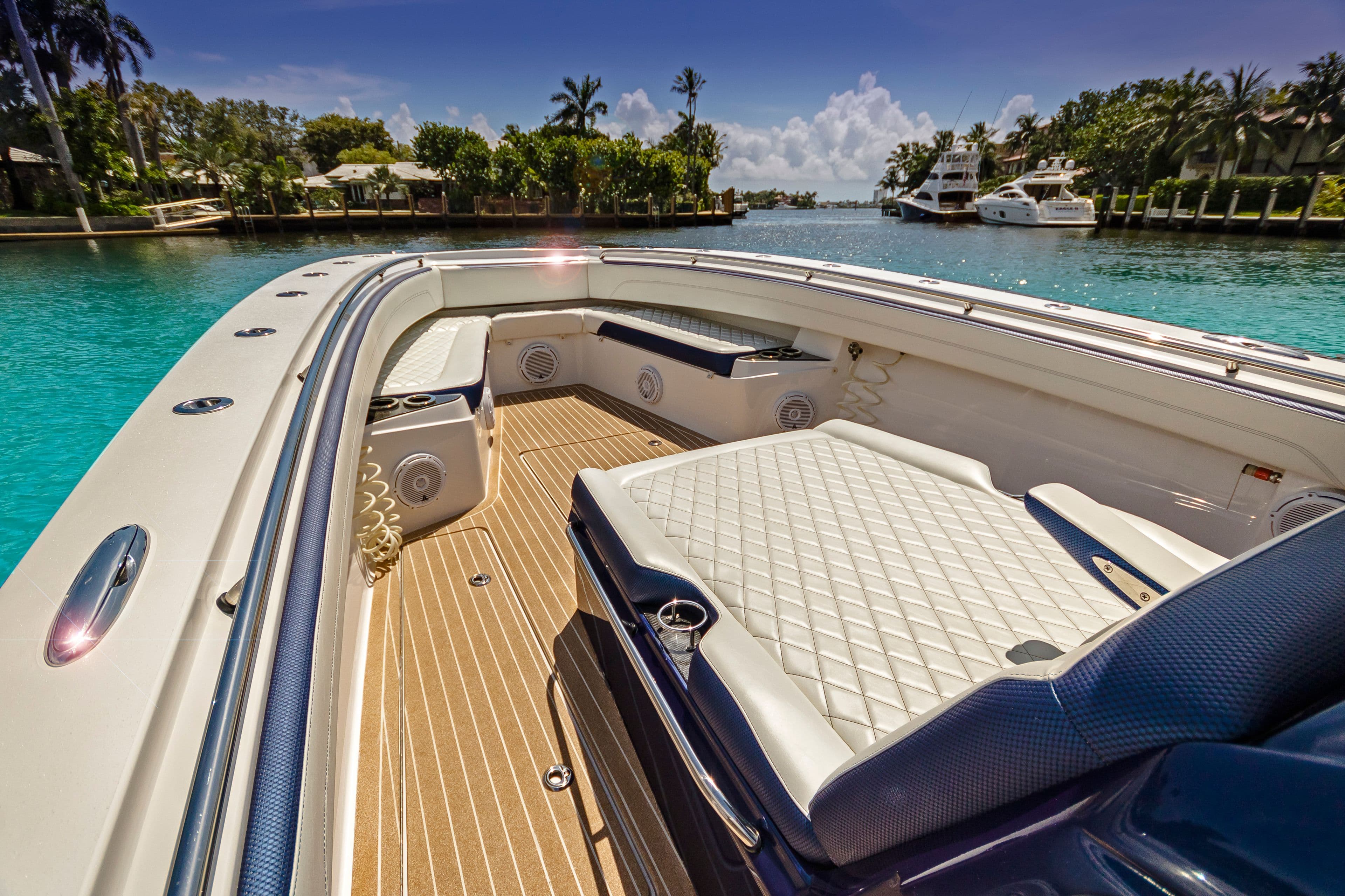 Luxurious 2026 Nor-Tech 392 Super Fish boat interior with plush seating and scenic waterfront view.