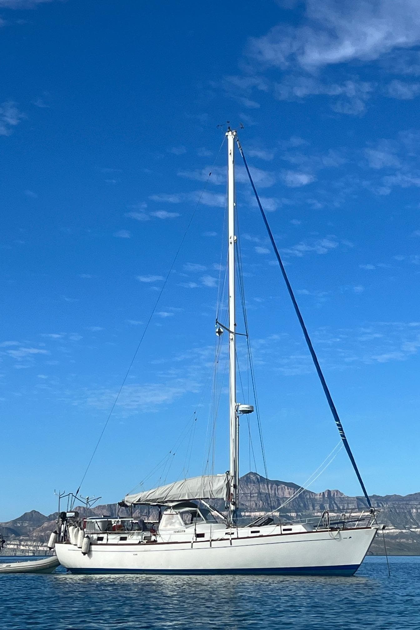 1979 Morgan 461 sailboat on calm water under a clear blue sky.