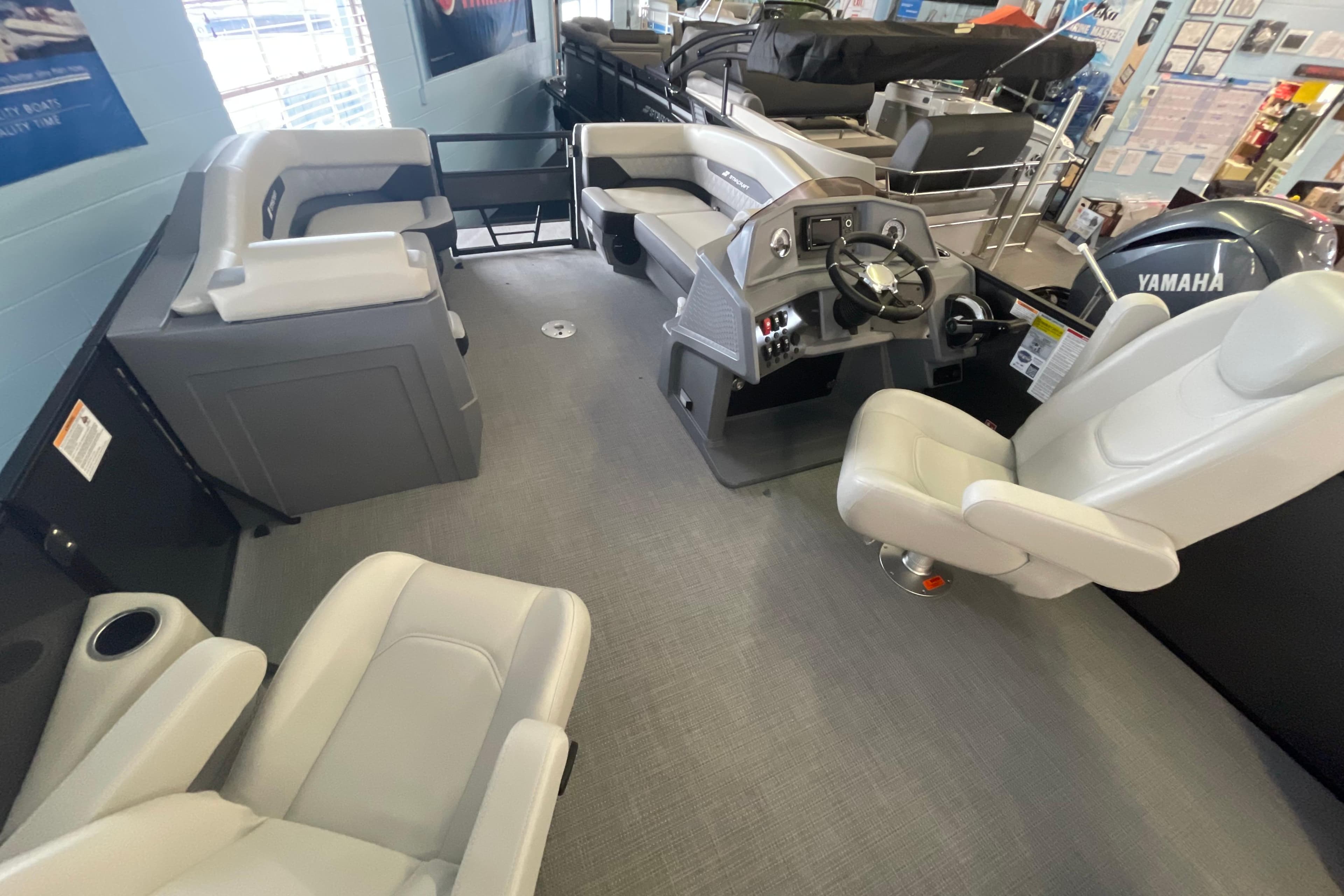 Interior of 2026 Starcraft VX 22 Q DH boat with modern seating and steering console.