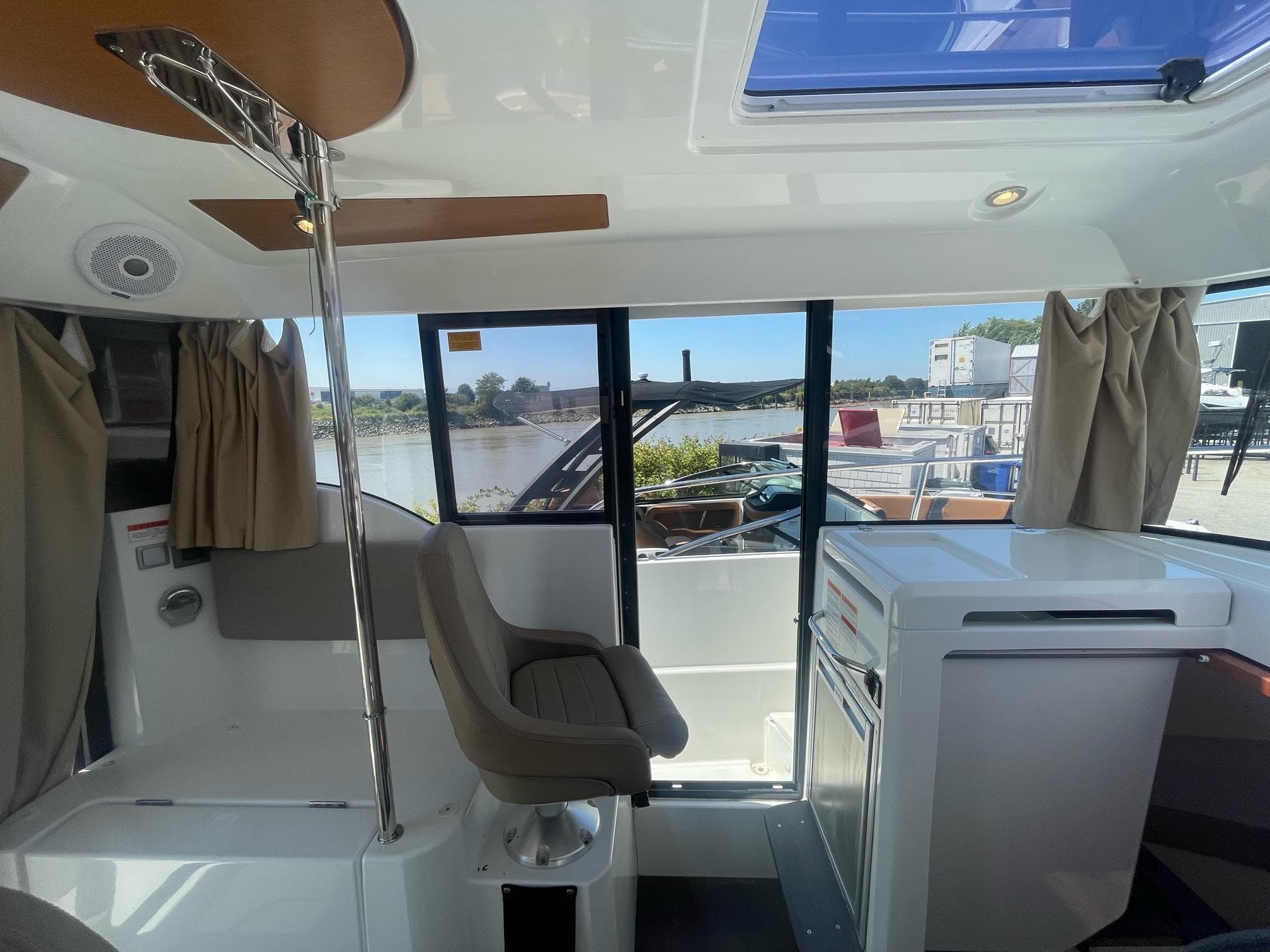 Interior of 2016 Jeanneau Merry Fisher 855 Marlin boat with seating and windows.