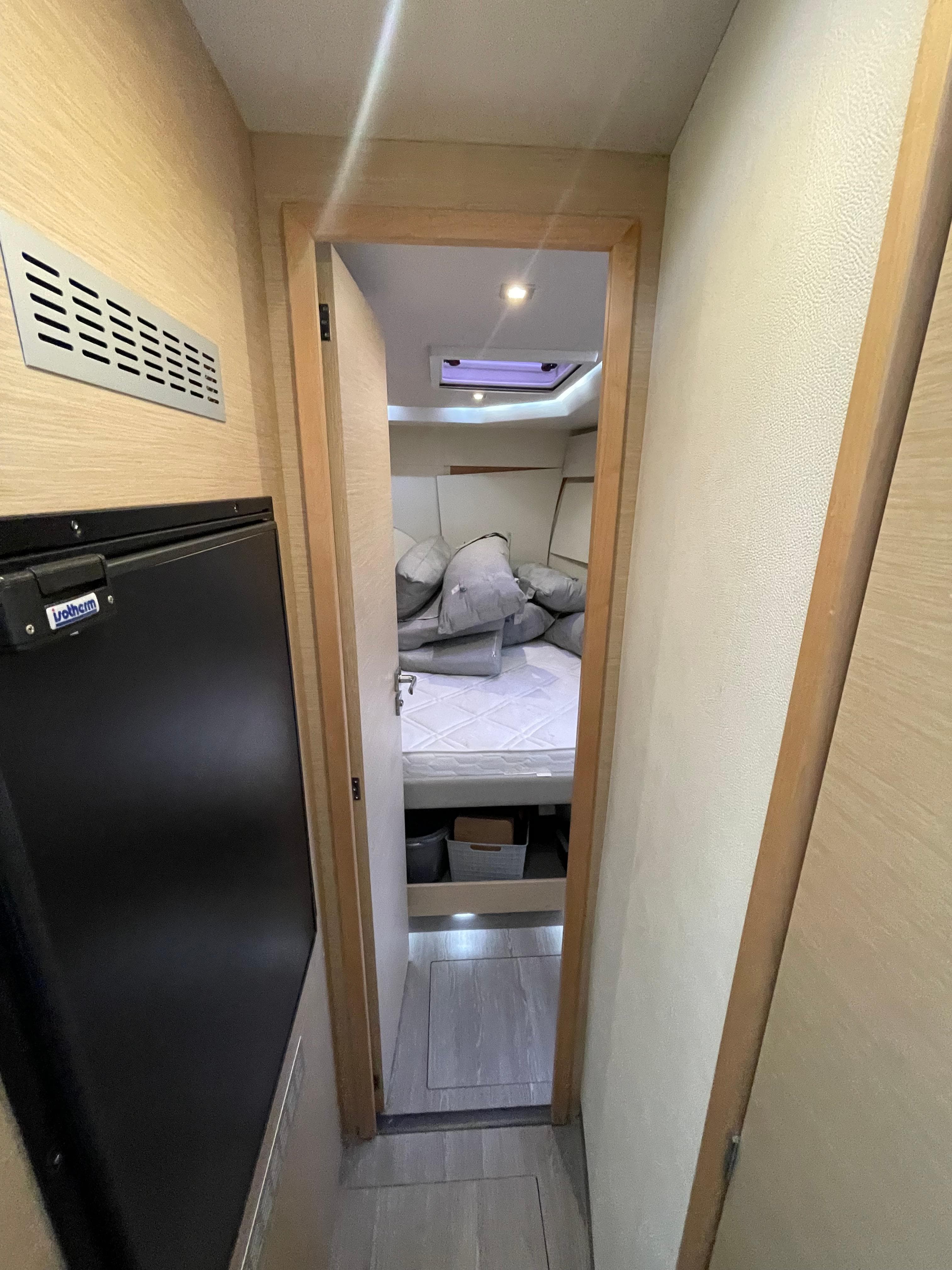 Cabin interior of 2018 Fountaine Pajot MY 37 yacht, featuring a cozy bed and modern design.