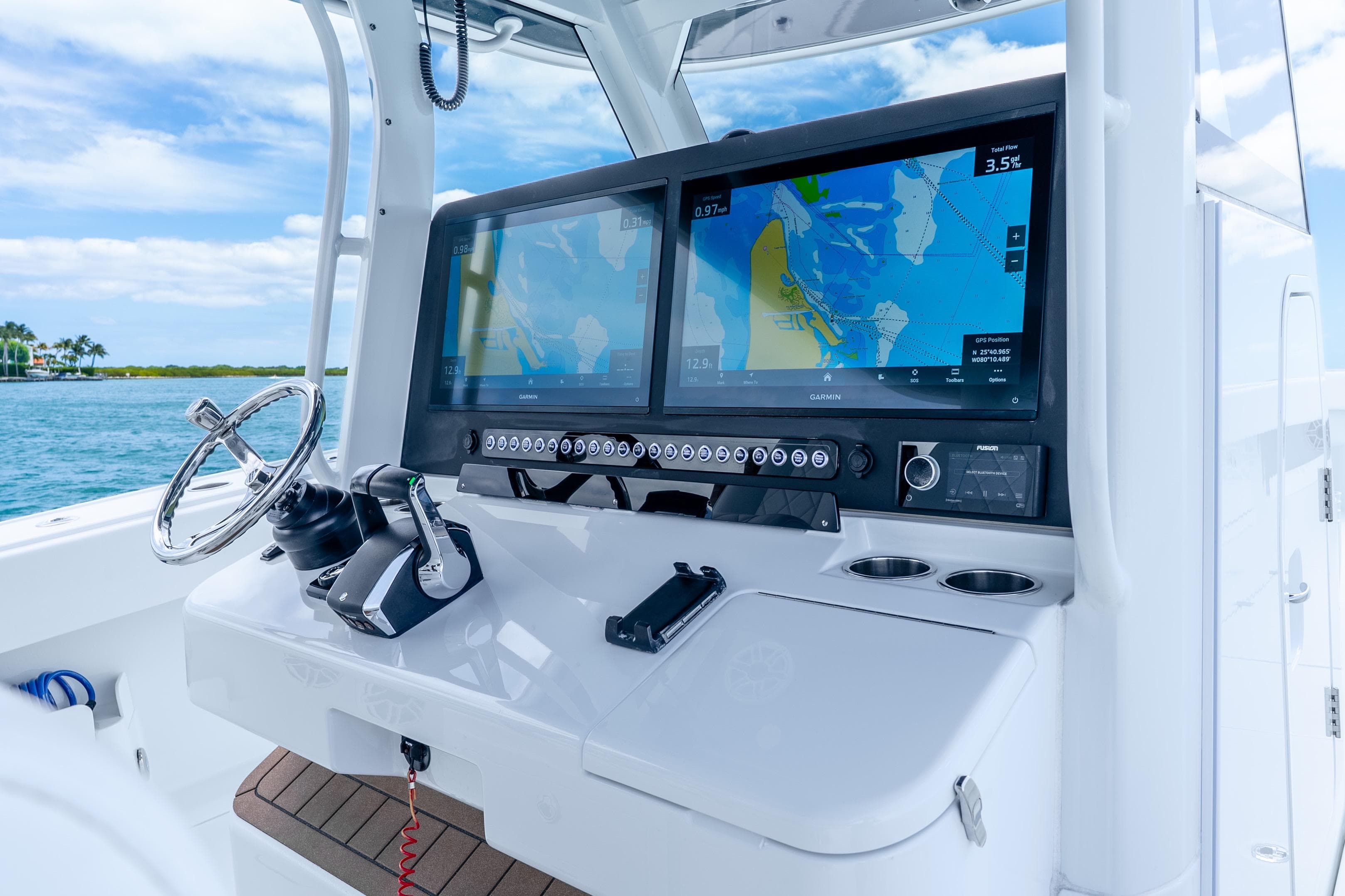 Helm of 2025 Freeman 43 boat with advanced navigation displays and controls.