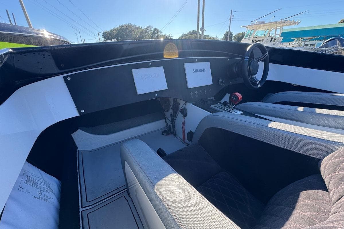 Interior of 1988 Activator 22 boat with modern dashboard and steering wheel.