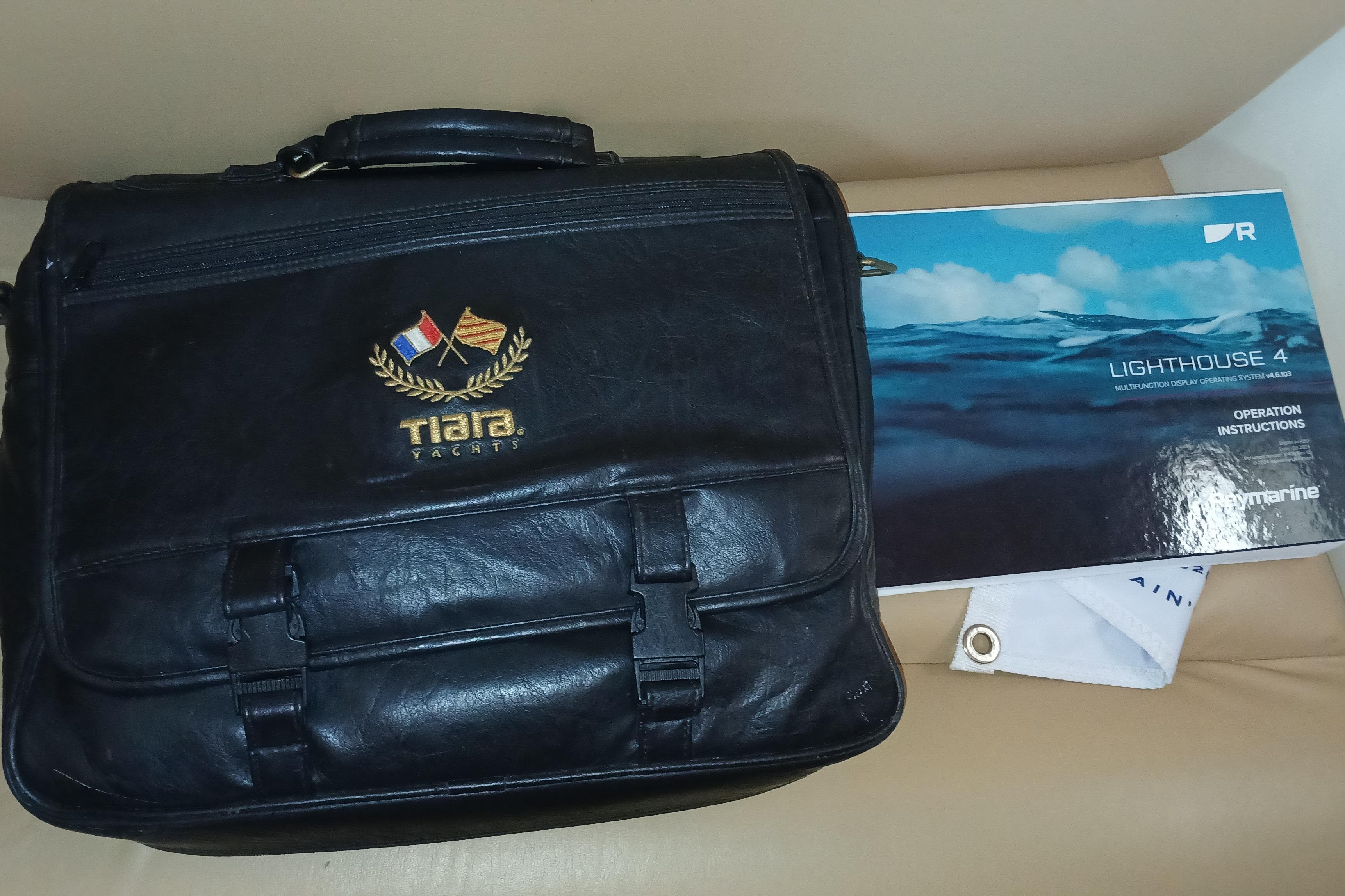 Black Tiara Yachts bag with manual, 2001 Tiara 2900 Open model.