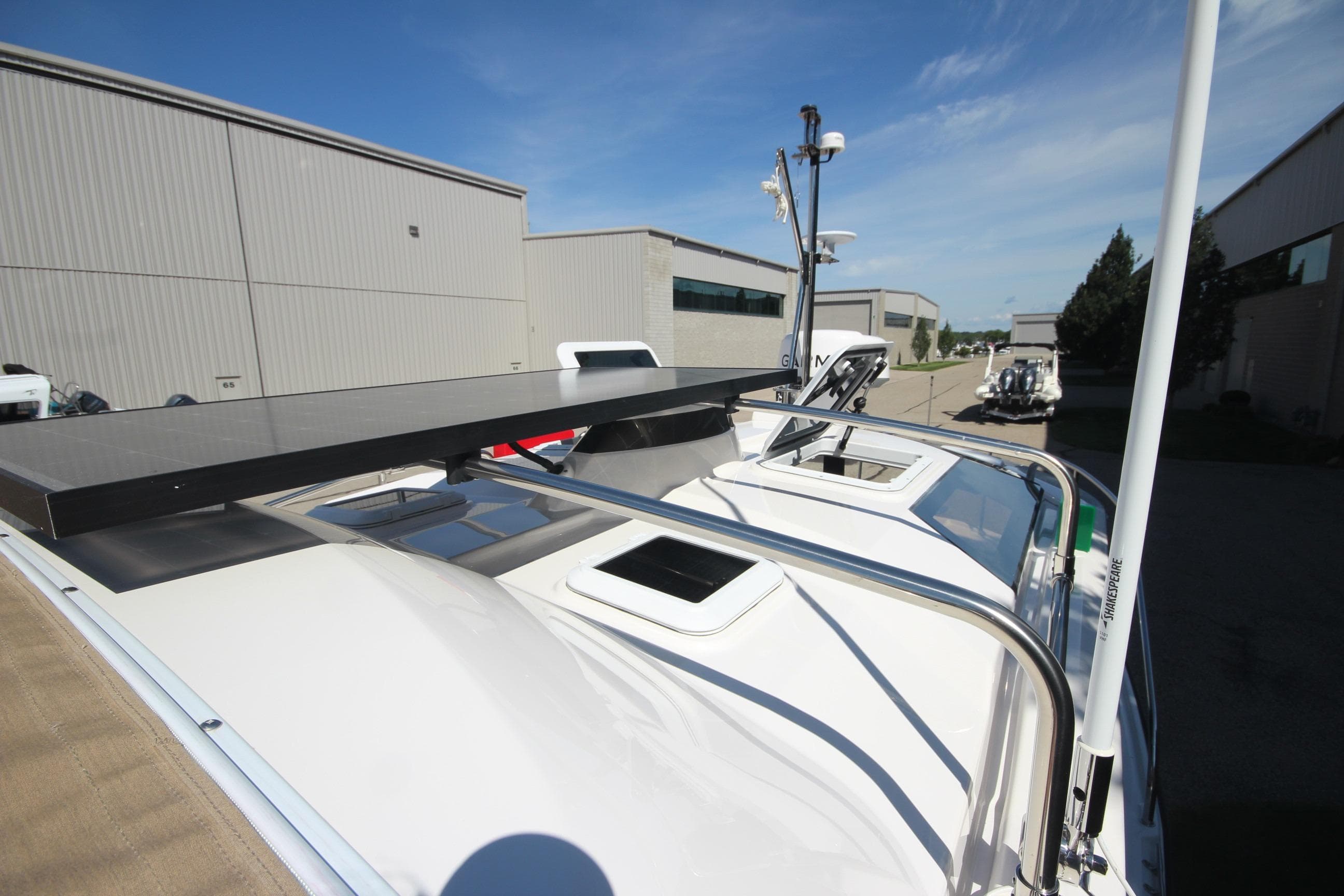 2025 Ranger Tugs R-25 Luxury Edition boat roof with solar panel and railing.