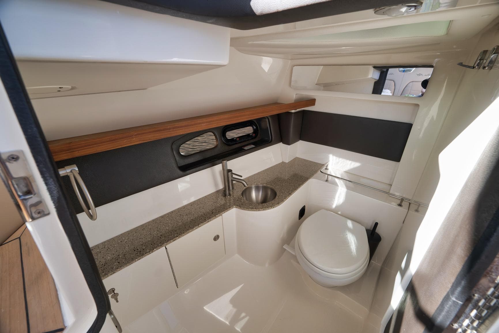 Luxurious 2016 Sea Ray 350 SLX boat bathroom with modern fixtures and elegant design.
