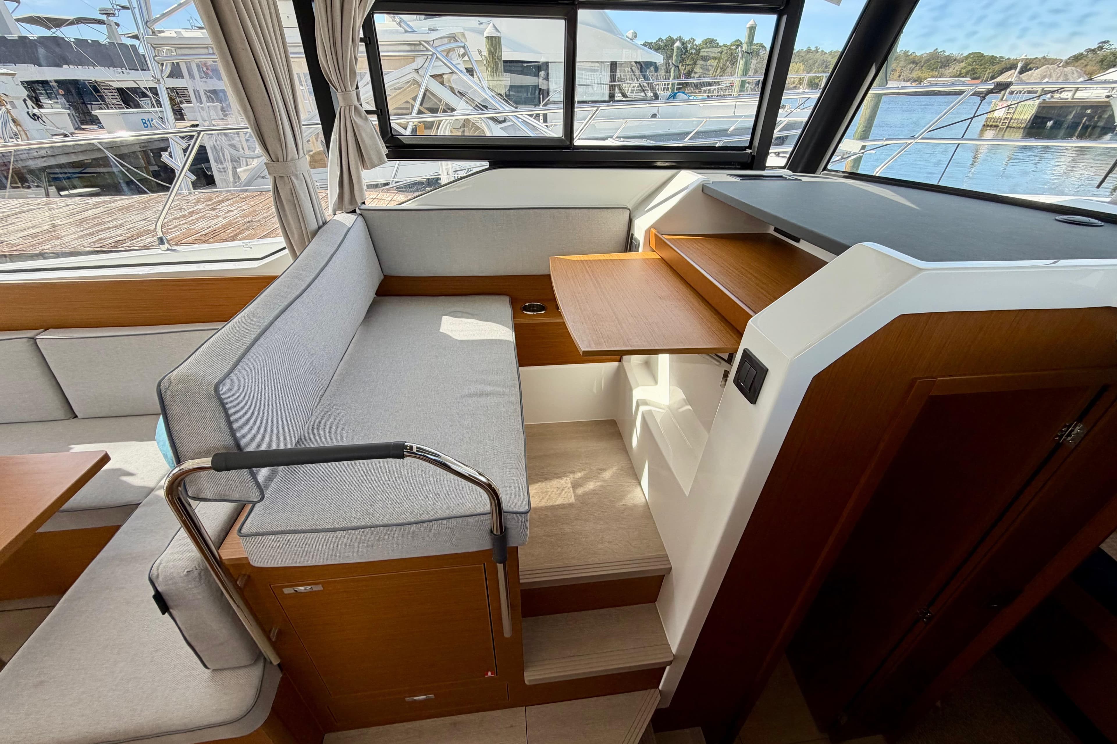 Interior of 2026 Beneteau Swift Trawler 37 Fly with seating and wooden accents.