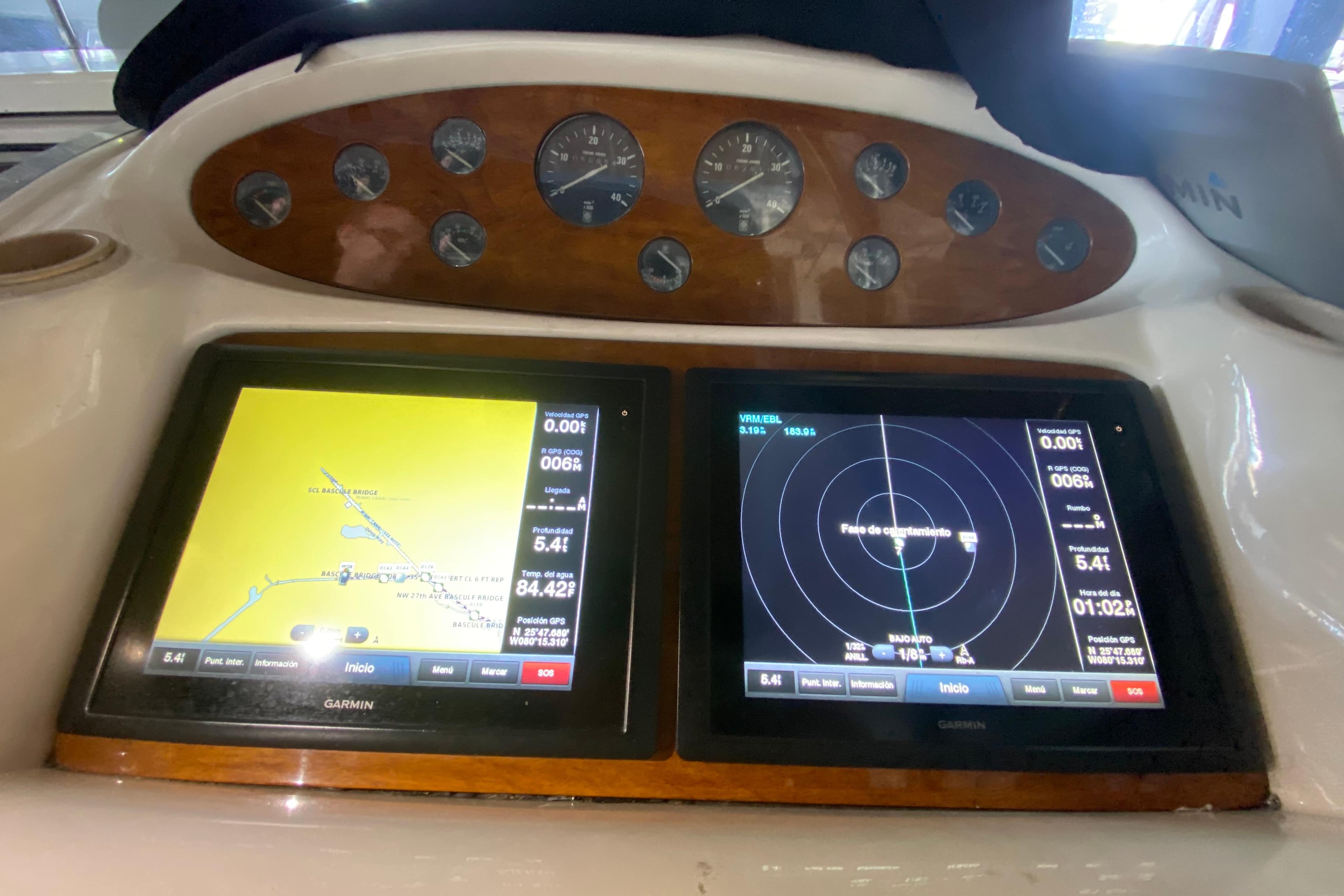 1997 Sunseeker Camargue 51 dashboard with navigation and radar displays.