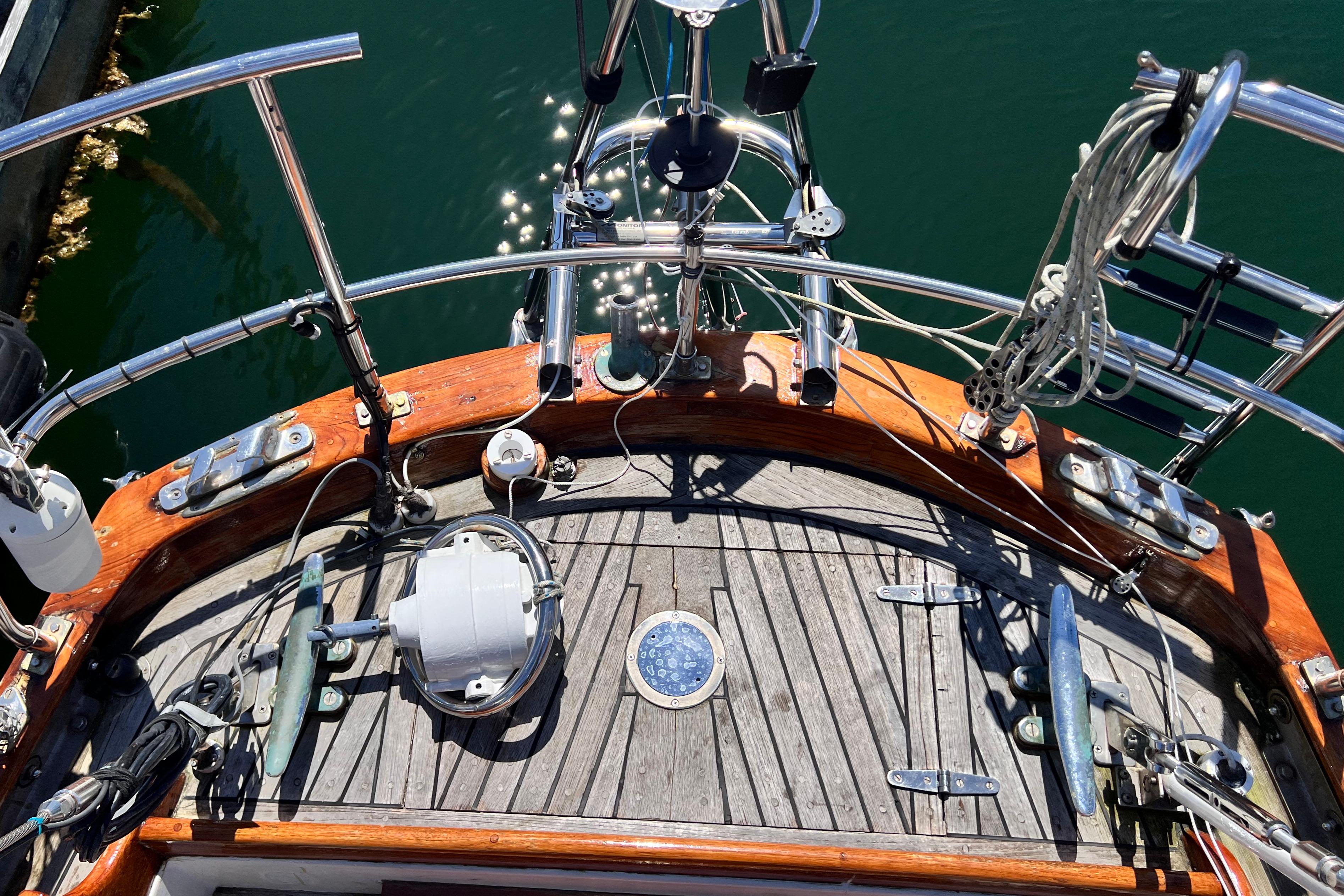 Deck view of 1987 Reliance 45 sailboat with wooden finish and nautical equipment.