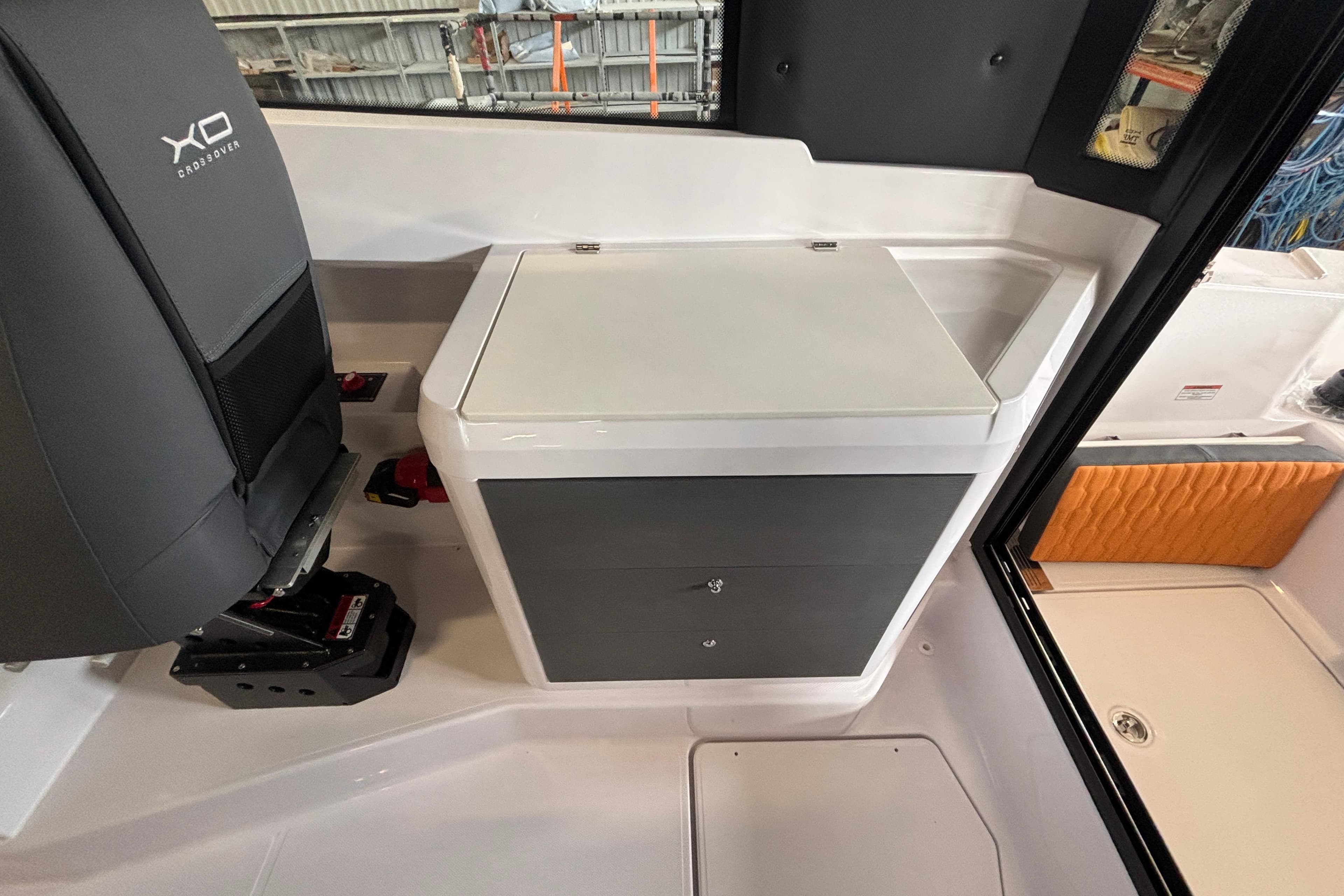 Interior of 2026 XO EXPLR 9 boat featuring seating and storage compartments.