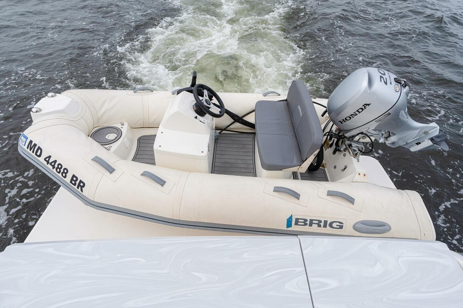 Inflatable boat with Honda motor on Tiara Yachts F44 Flybridge, 2021 model.