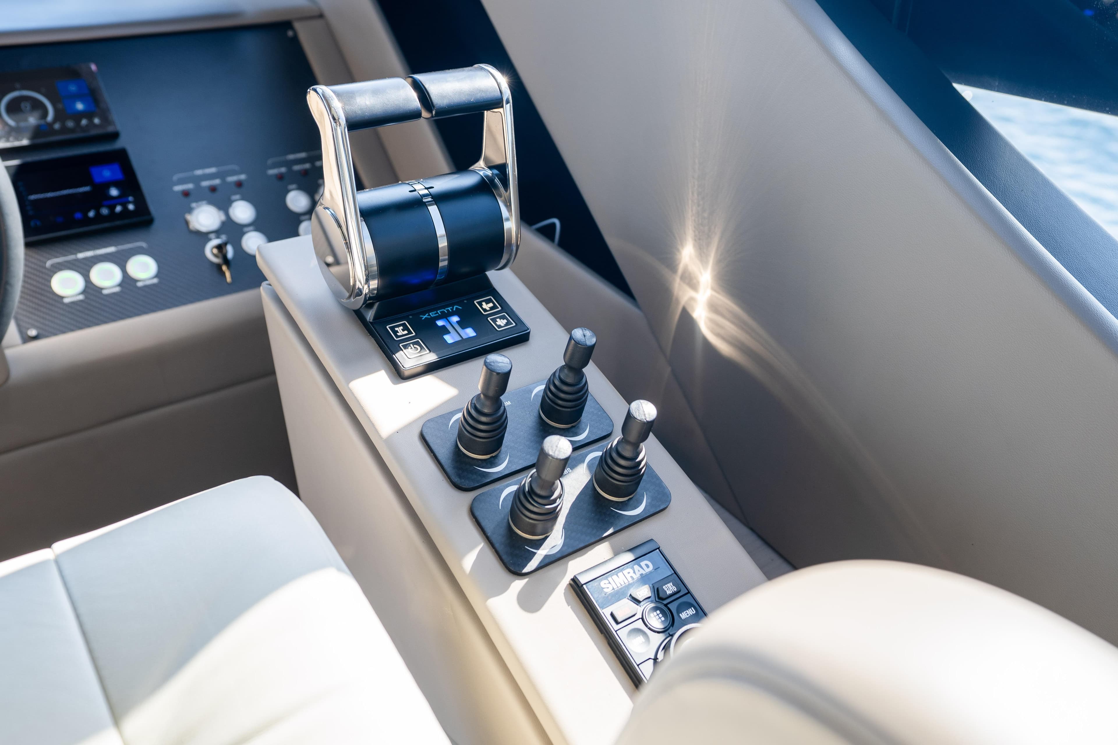 Control panel of 2024 Pershing 7X yacht with advanced navigation and throttle controls.