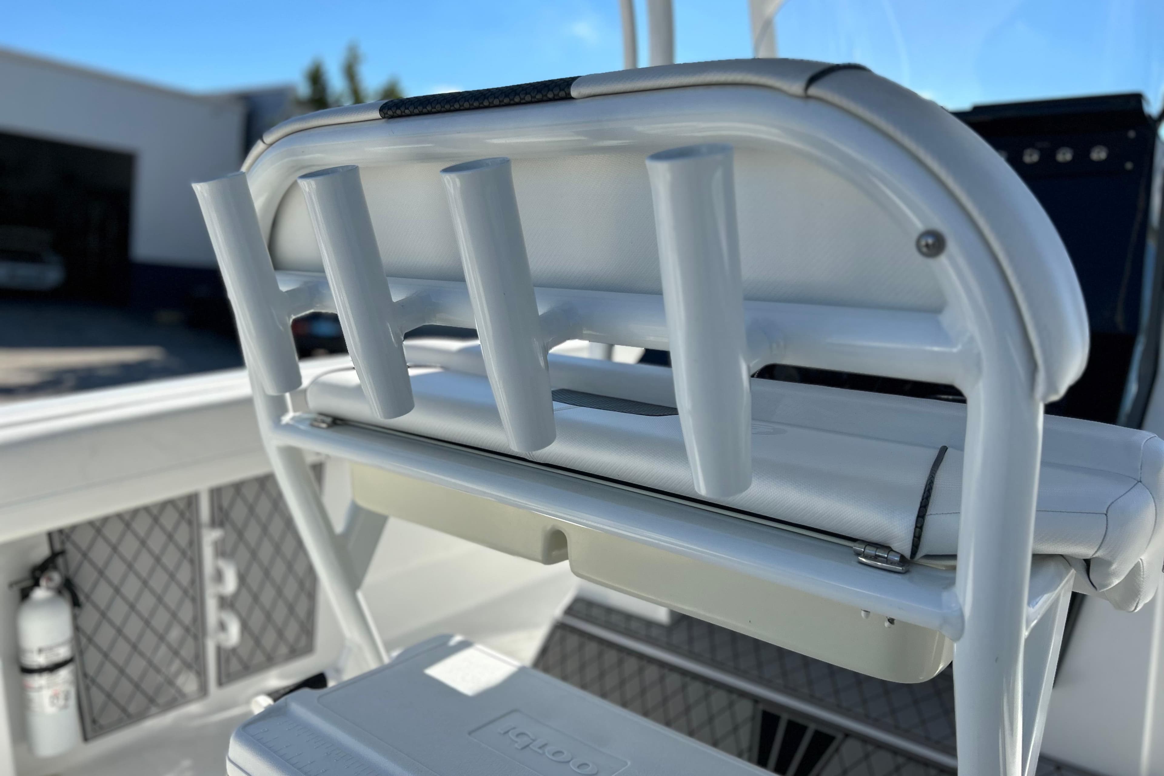 2023 Wellcraft 222 Scarab Offshore boat with rod holders and seating detail.