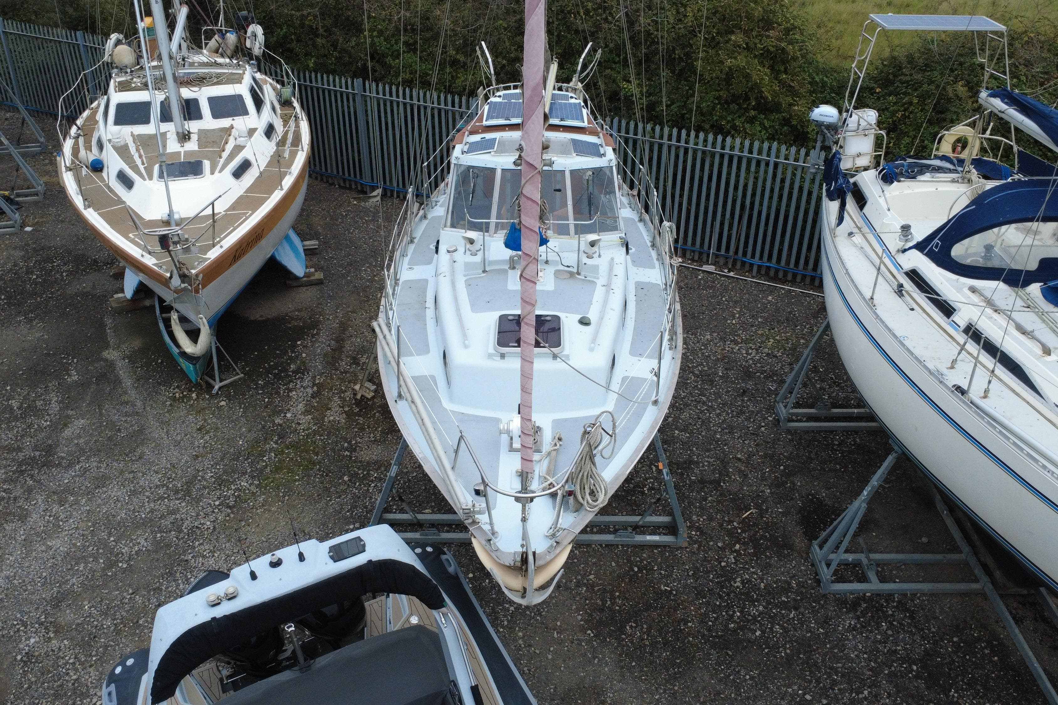 1972 Barbary Ketch sailboat on dry dock, surrounded by other boats, viewed from above.