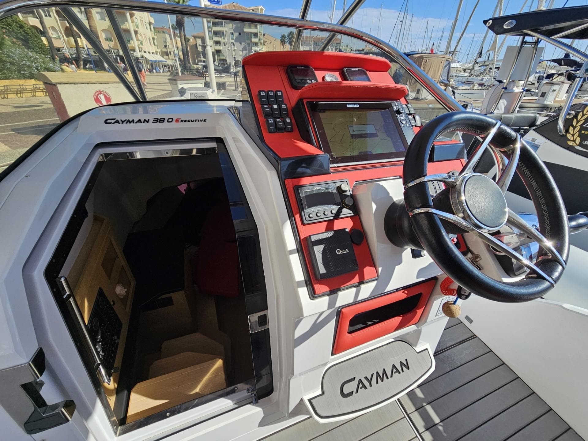 Ranieri Cayman 38.0 Executive 2019, helm console and cabin entrance at marina.