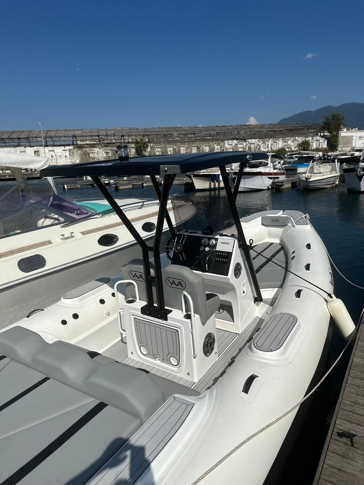Aqvaboats Luxrib 25, 2025 model, docked at marina on sunny day.