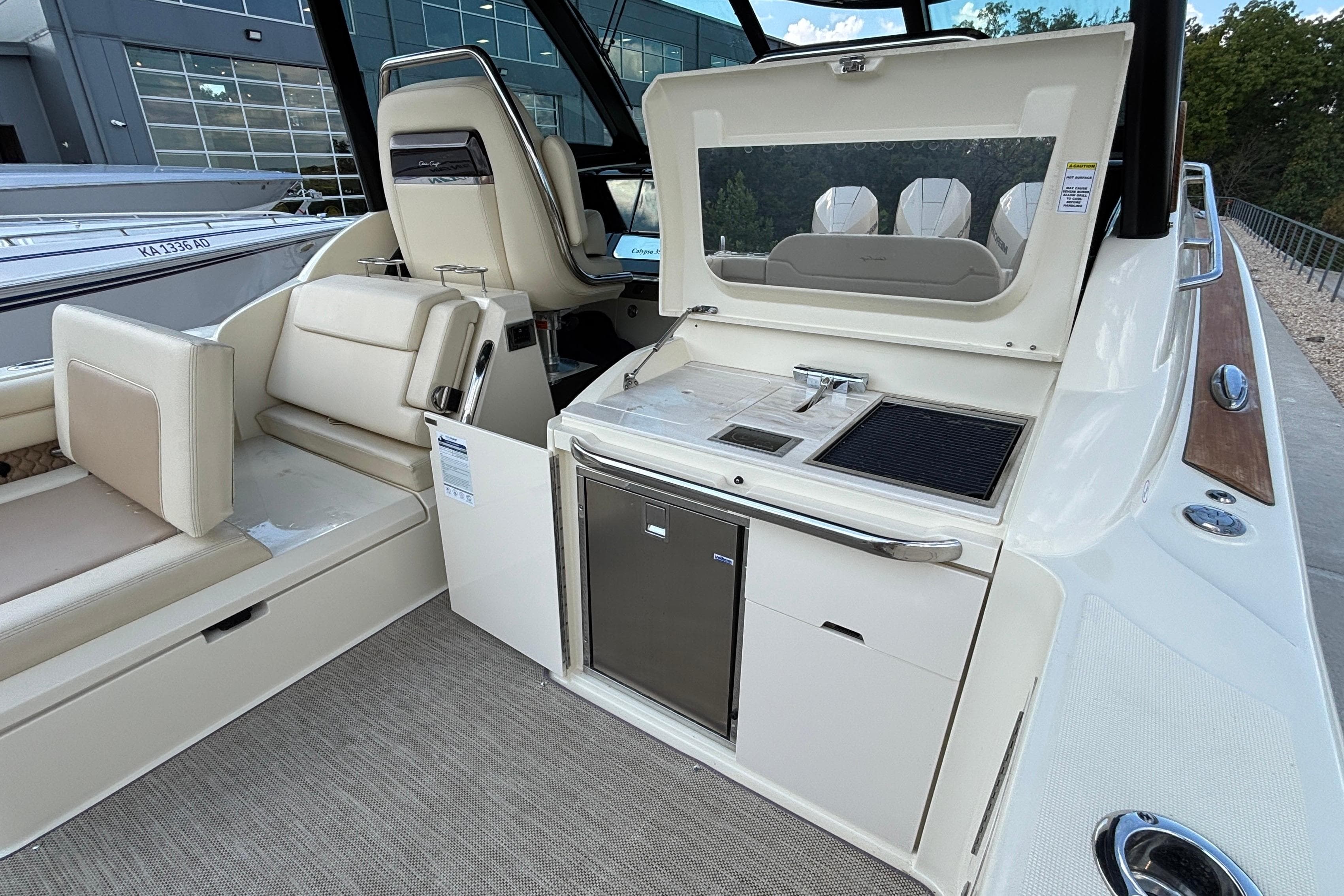 2021 Chris-Craft Calypso 35 boat interior with seating and kitchenette area.