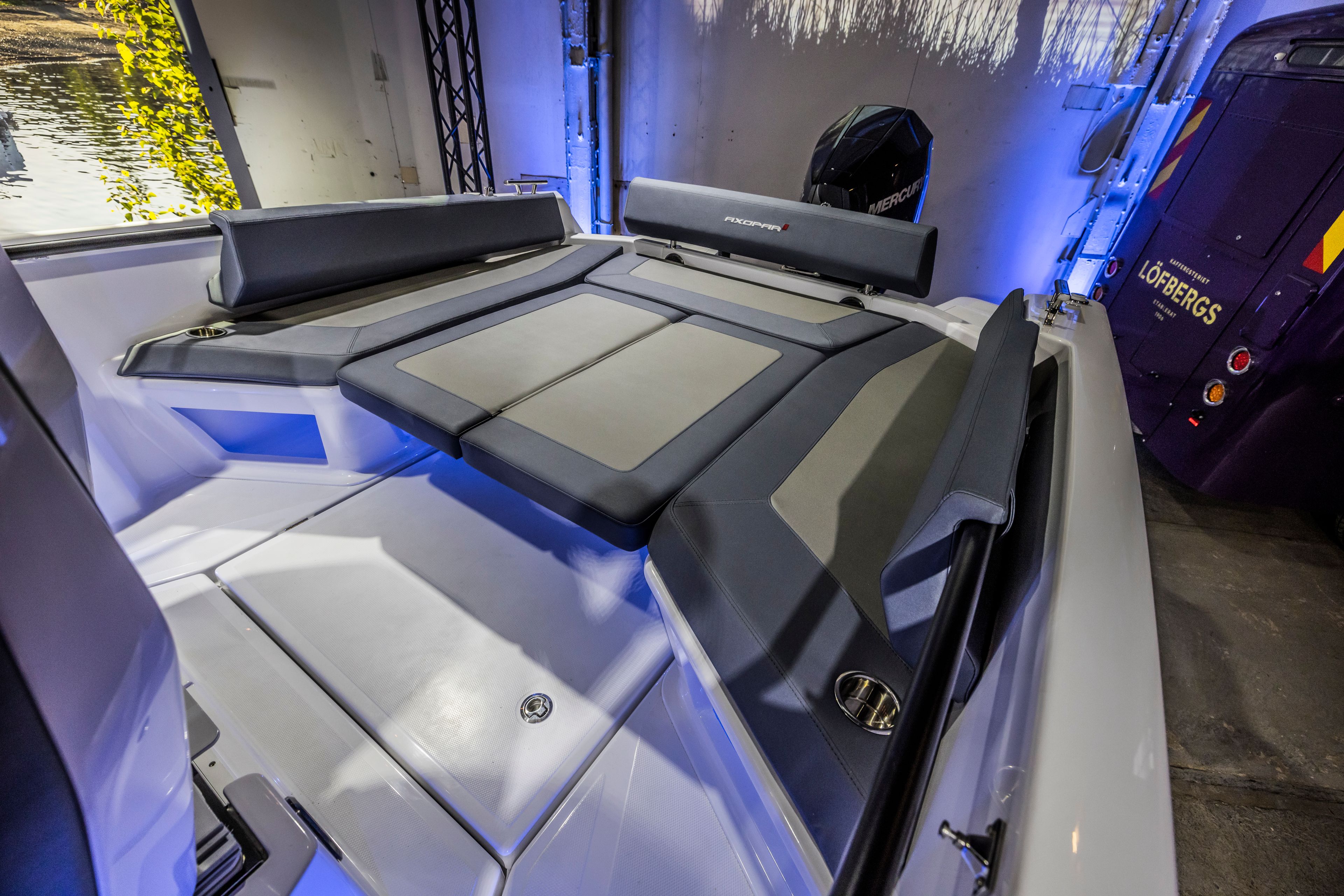 2021 Axopar 22 Spyder interior with cushioned seating and modern design.