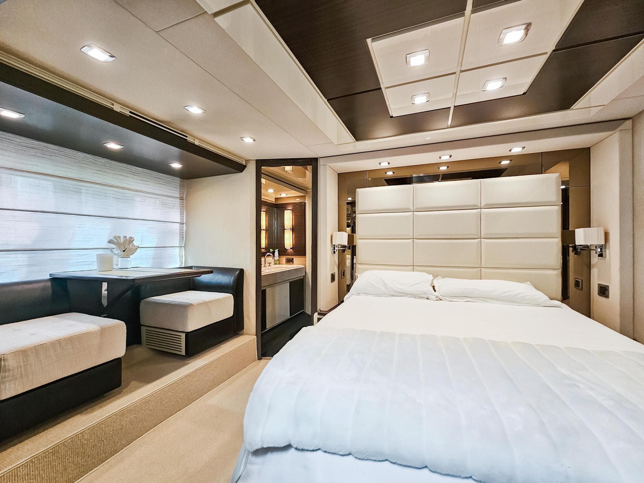 Luxurious bedroom interior of 2013 Azimut 70 yacht with modern decor and ambient lighting.
