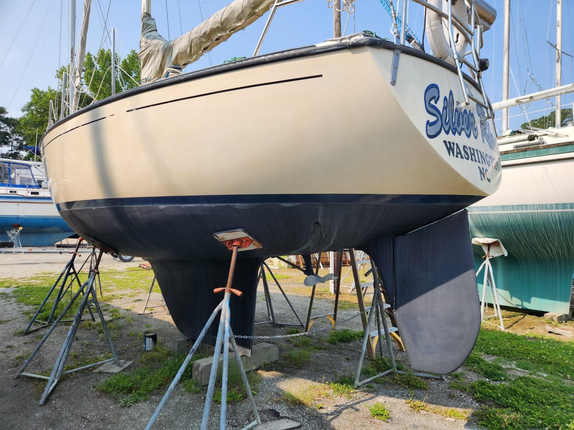 1984 S2 9.2 sailboat on stands for maintenance in a boatyard.