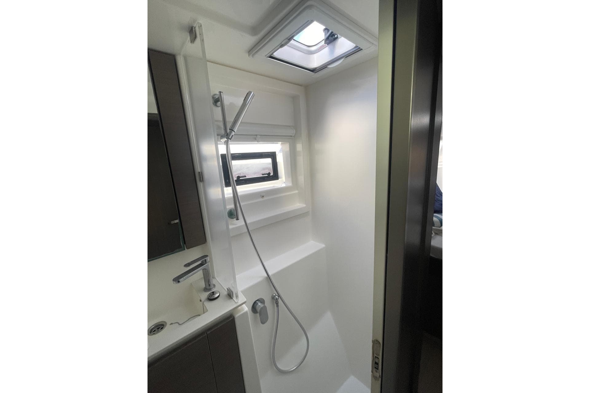 Modern shower area in 2022 Leopard 42 yacht with sleek fixtures and skylight.