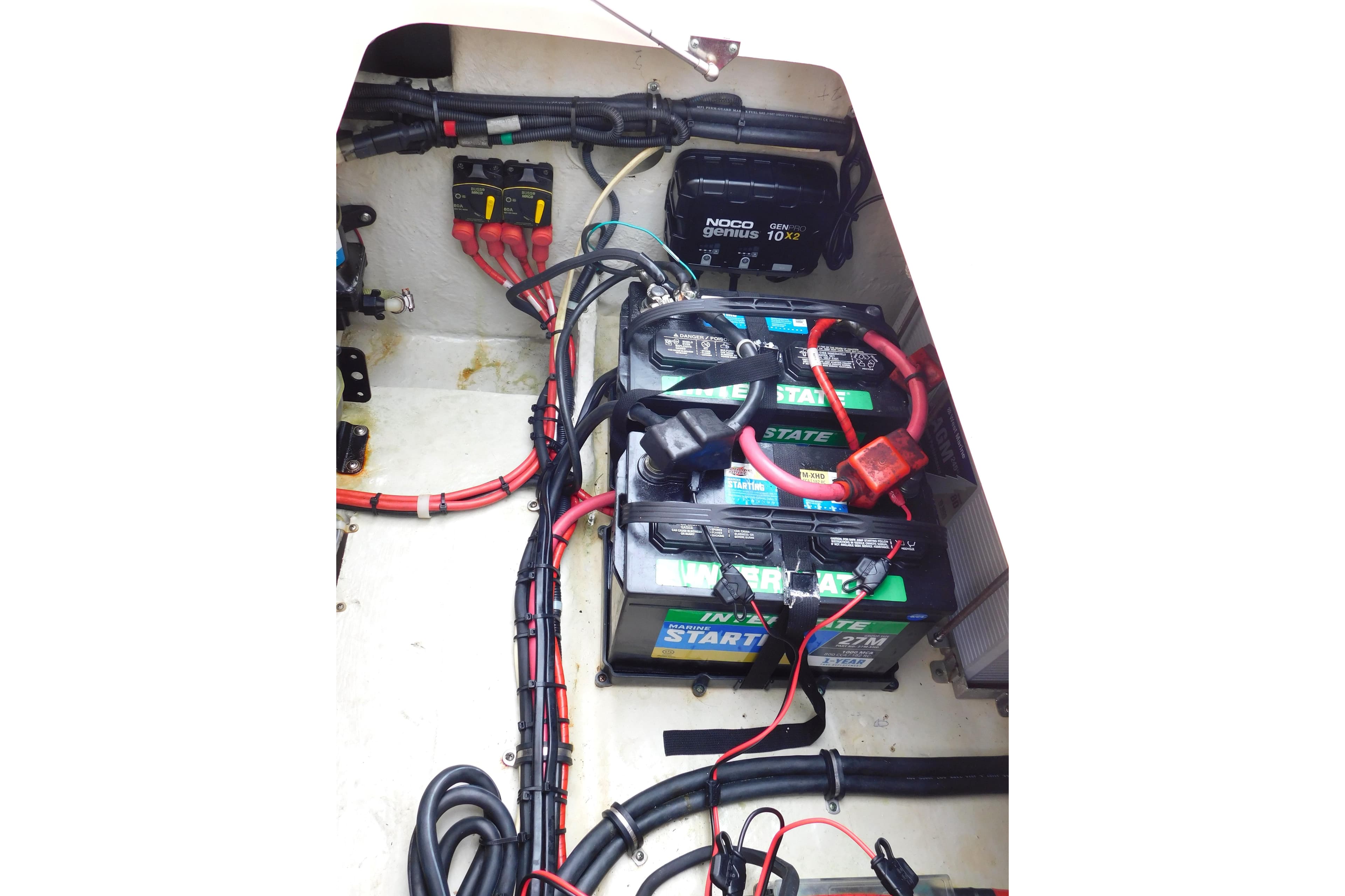 Electrical system of a 2015 Grady-White Freedom 307 boat, featuring batteries and wiring.