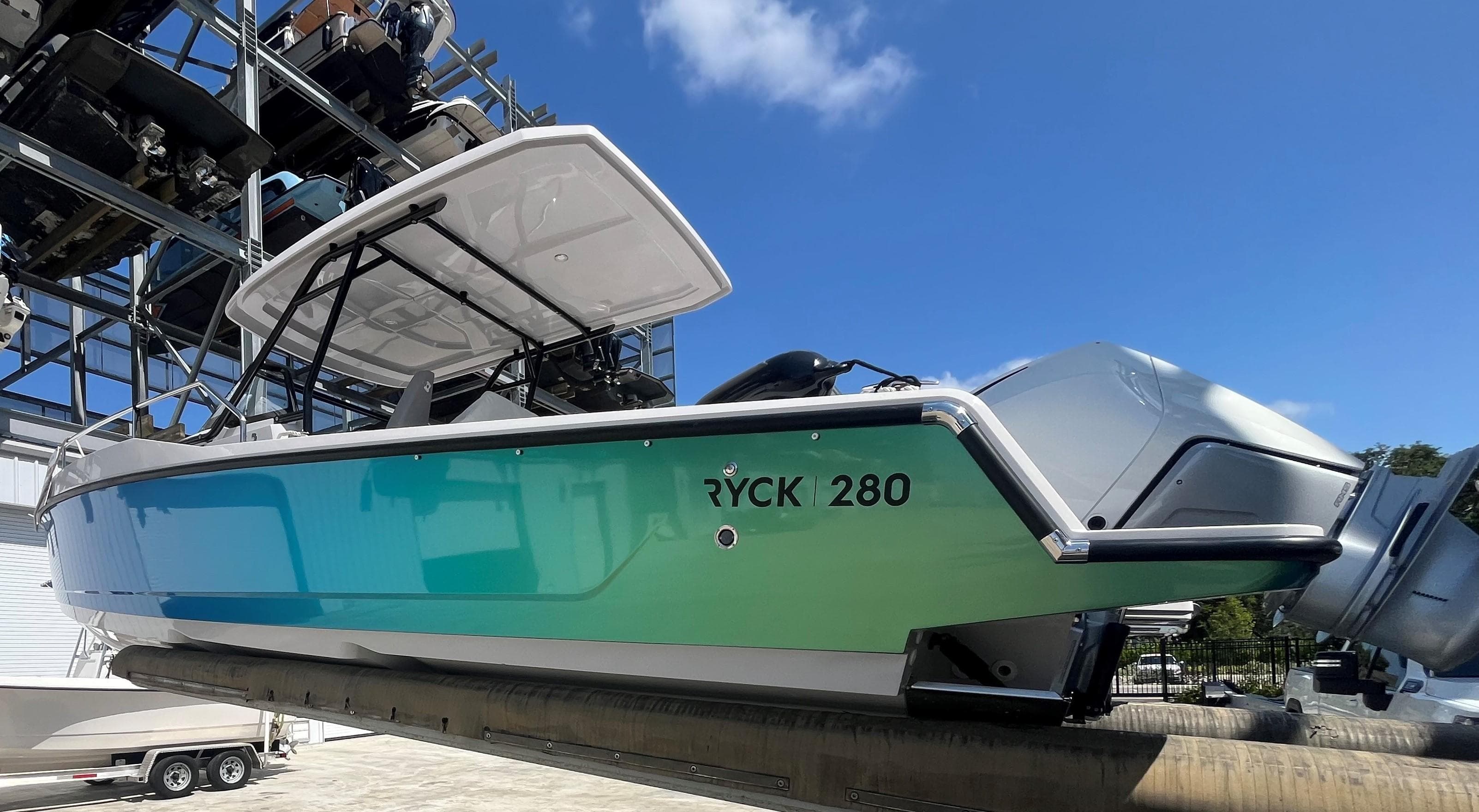 2023 RYCK 280 boat on a storage rack.