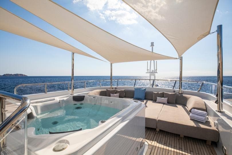 Luxurious 1998 Absolute Semi Displacement yacht with jacuzzi and sunshade on deck.