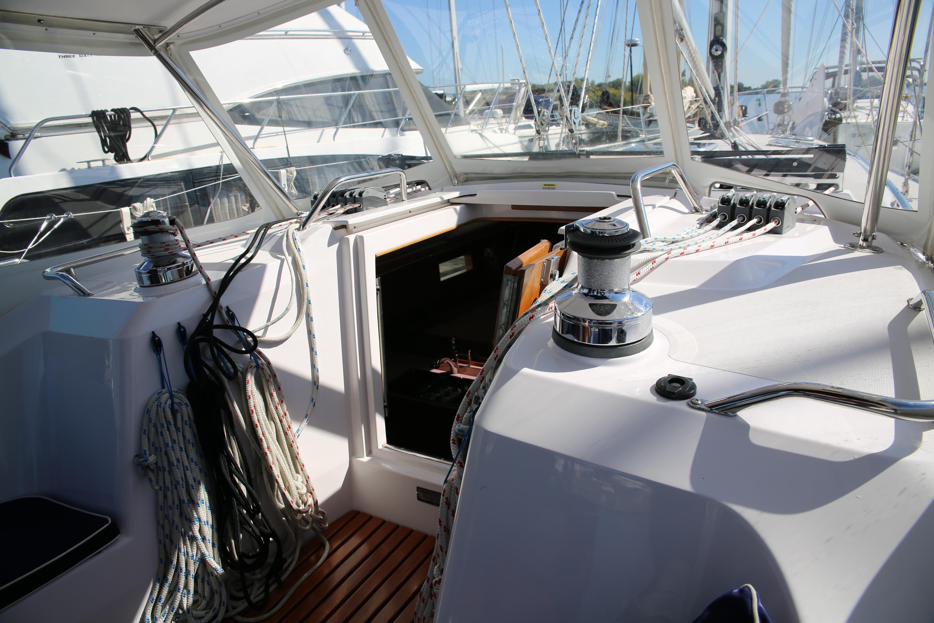 2014 Catalina 445 sailboat cockpit with ropes and winches, docked at marina.