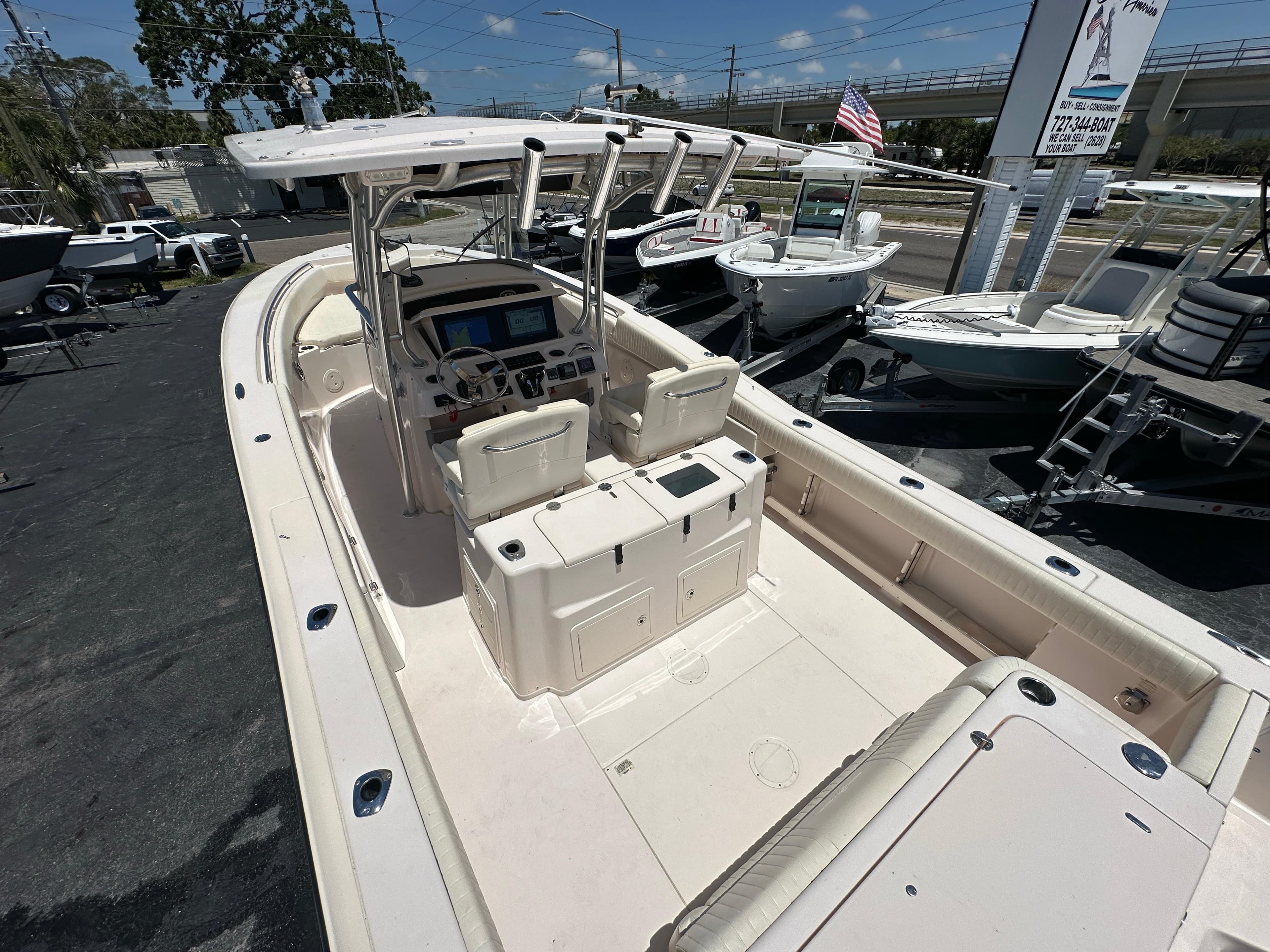 2013 Grady-White Canyon 306 boat with spacious deck and modern controls.