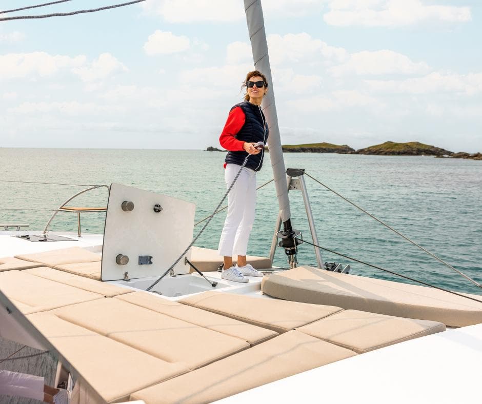 Woman enjoying the deck of a 2025 Fountaine Pajot NEW 41 catamaran.