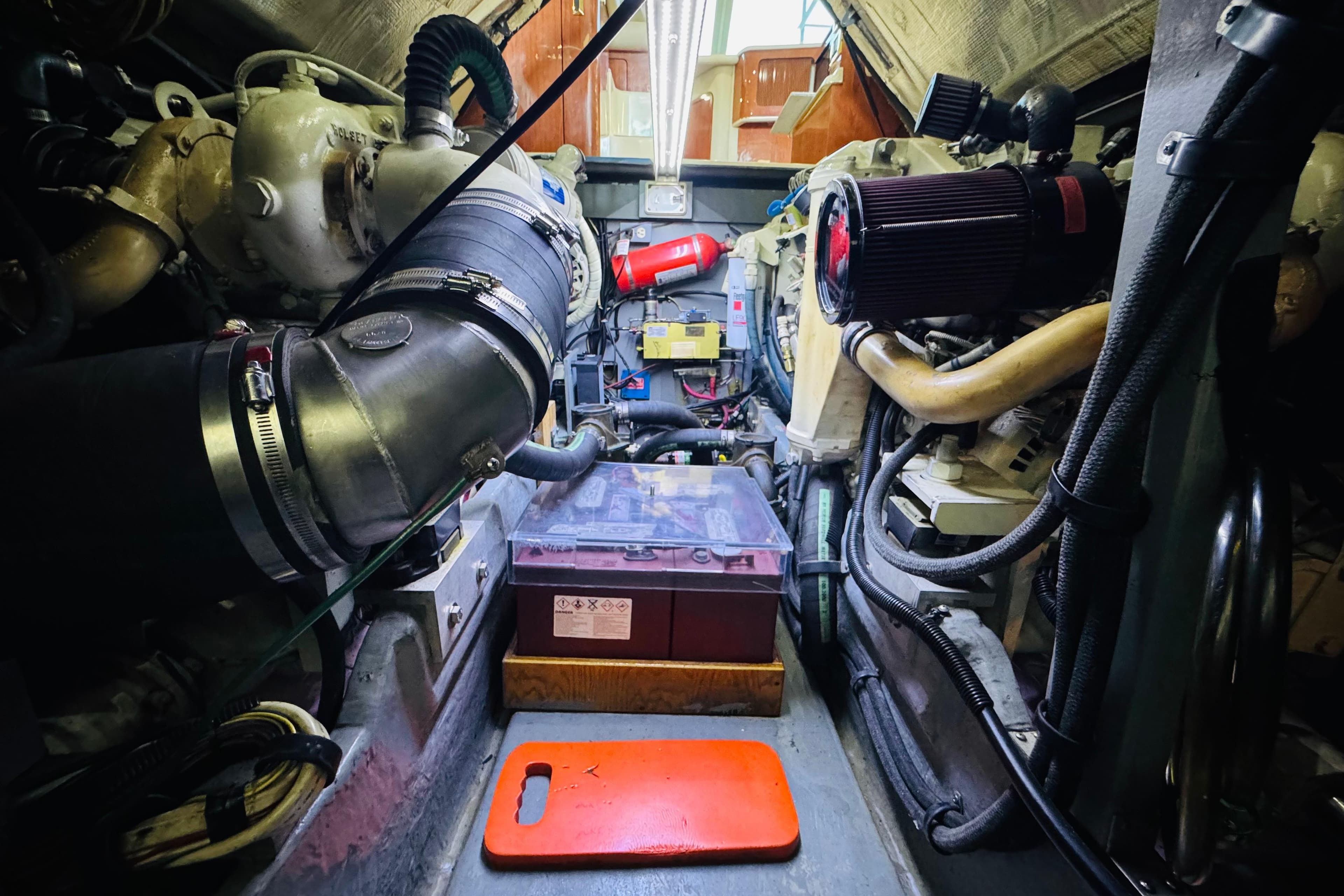 Engine room of a 1999 Sea Ray 400 Sedan Bridge, showcasing mechanical components.