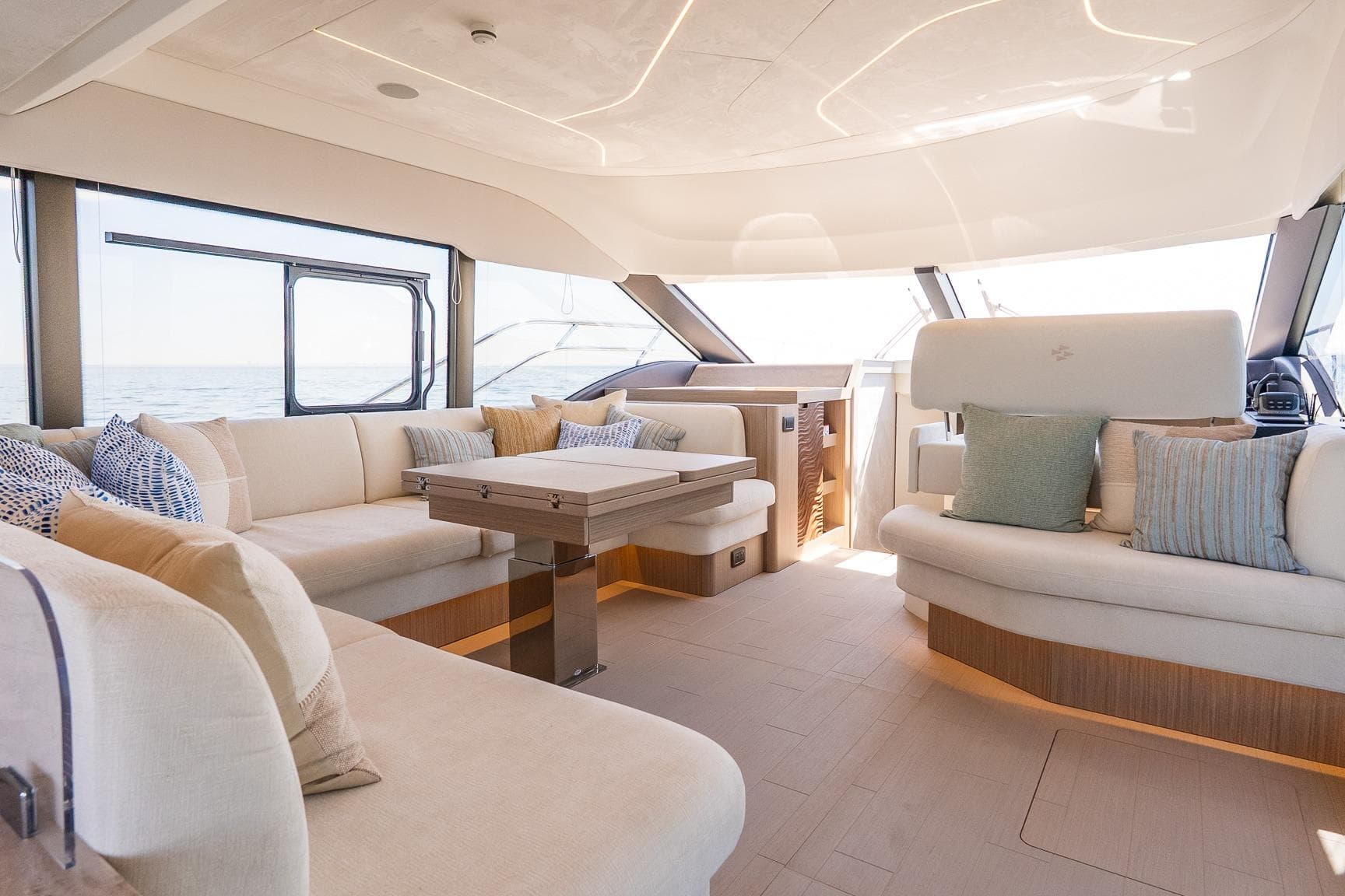 Luxurious interior of 2026 Prestige F5.7 yacht with elegant seating and modern design.