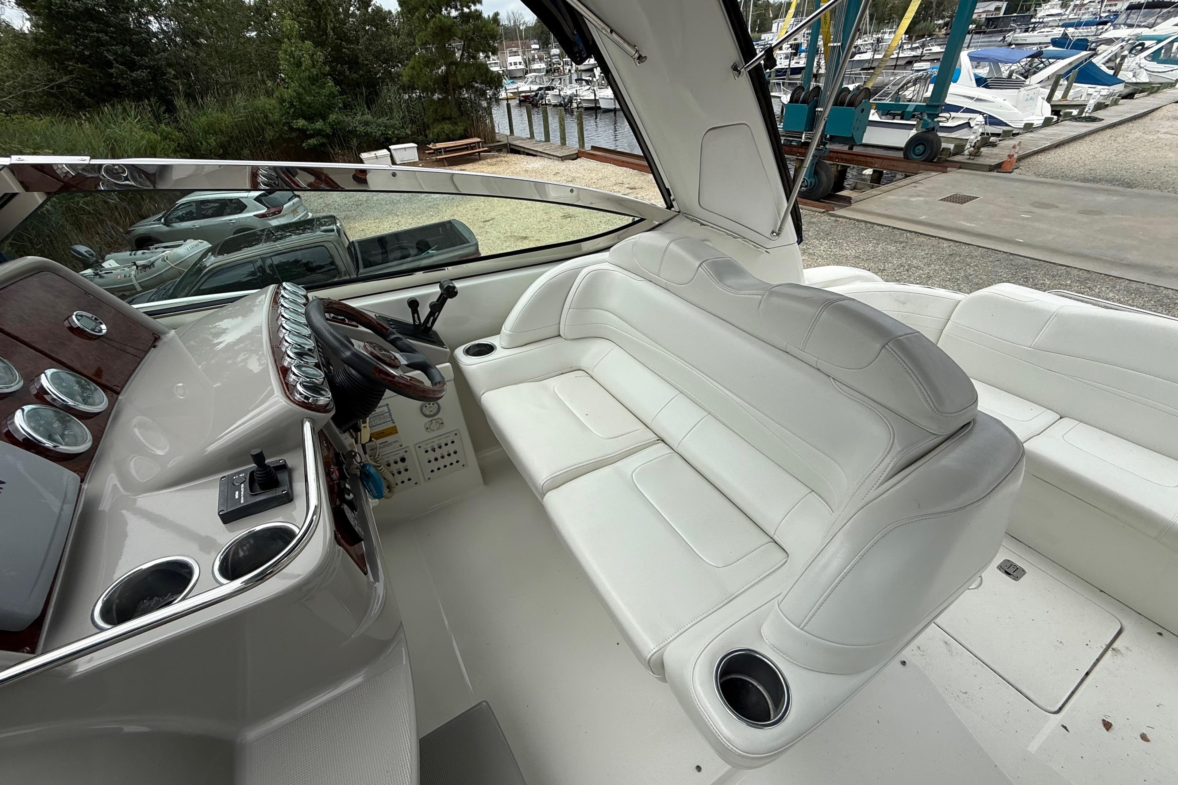 2003 Formula 37 PC boat interior with white seating and control panel.
