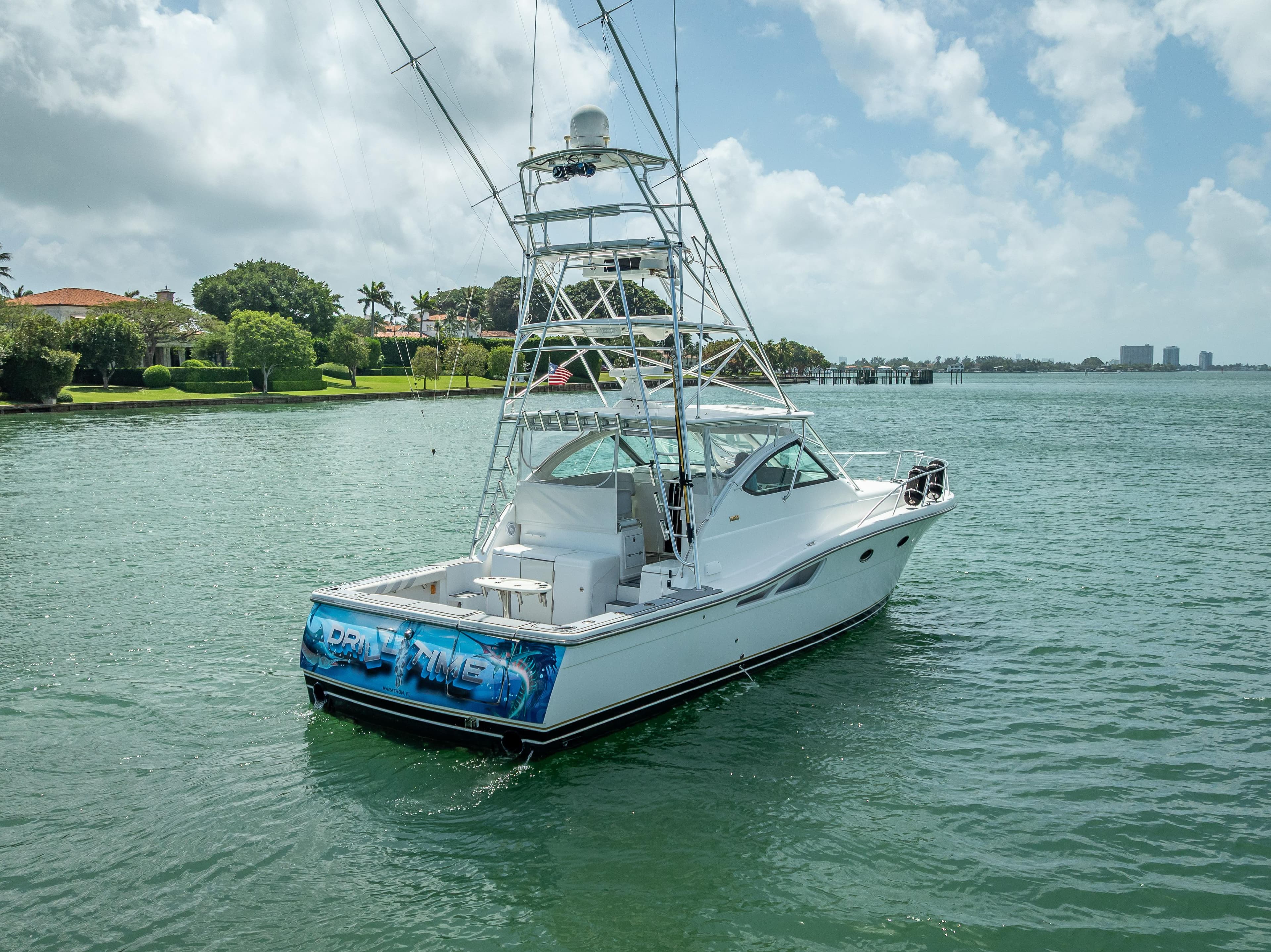 2006 Tiara Yachts 4200 Open on calm water, featuring a sleek design and fishing tower.