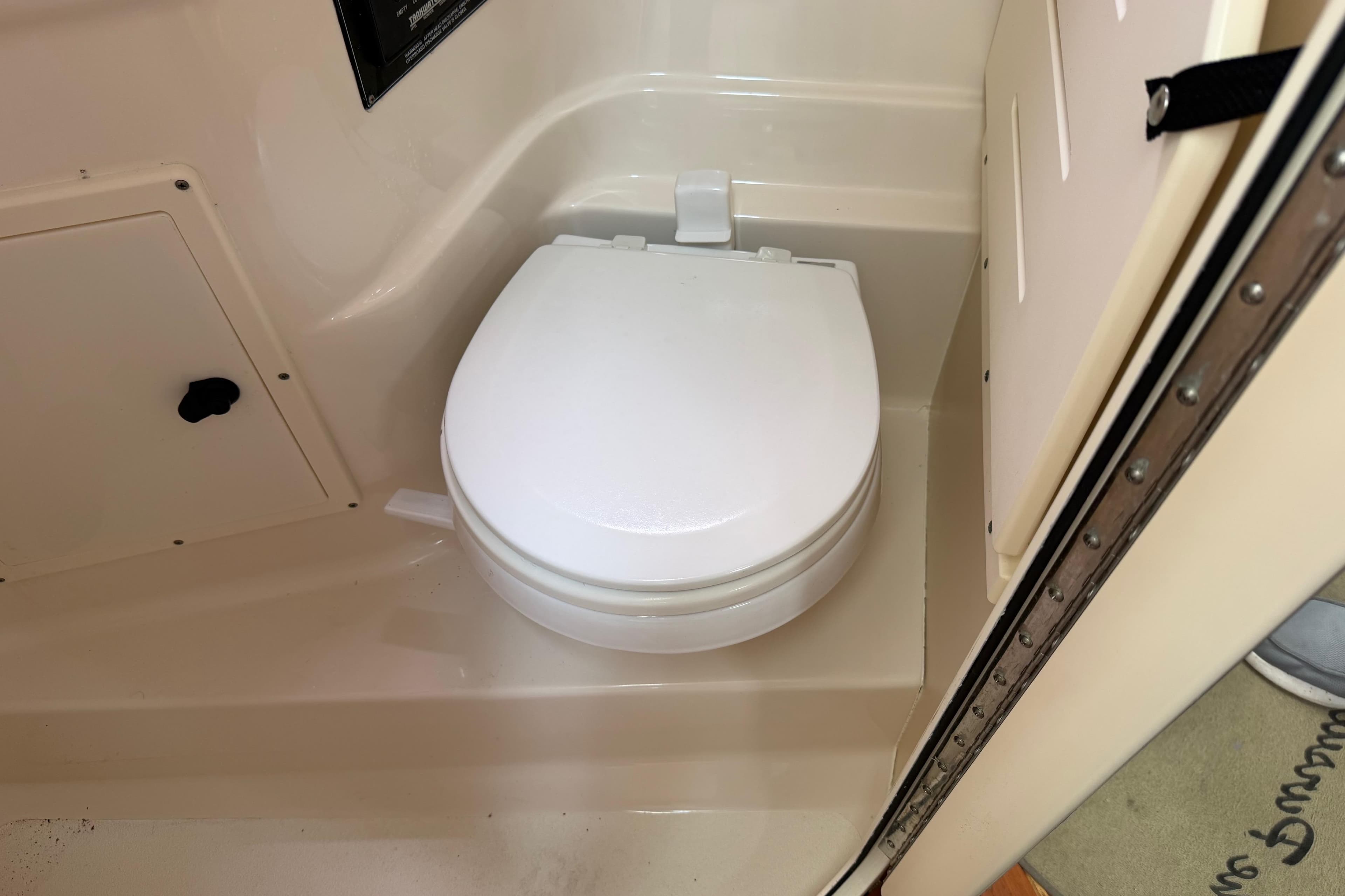 Toilet in 2008 Pursuit OS 335 Offshore boat bathroom.