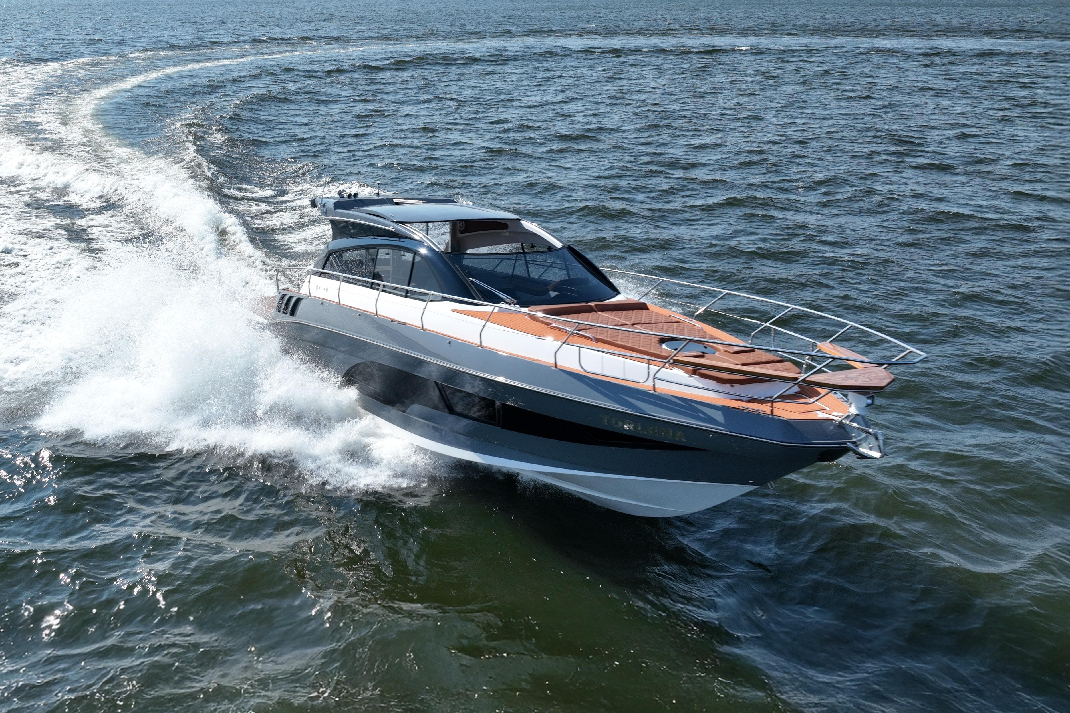 Luxurious 2026 Hanover 415 yacht cruising swiftly on open water.