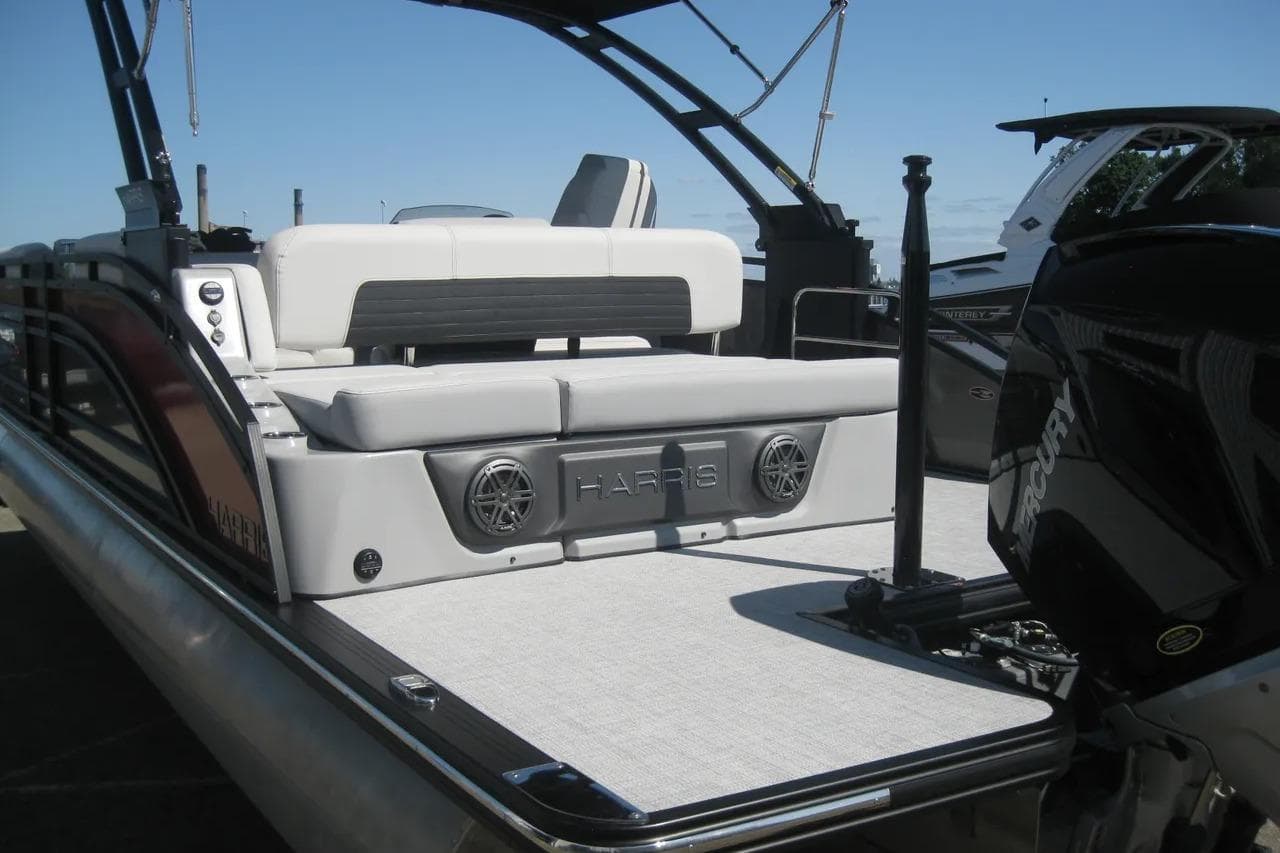 2023 Harris FloteBote 250 Solstice pontoon boat with spacious seating and modern design.