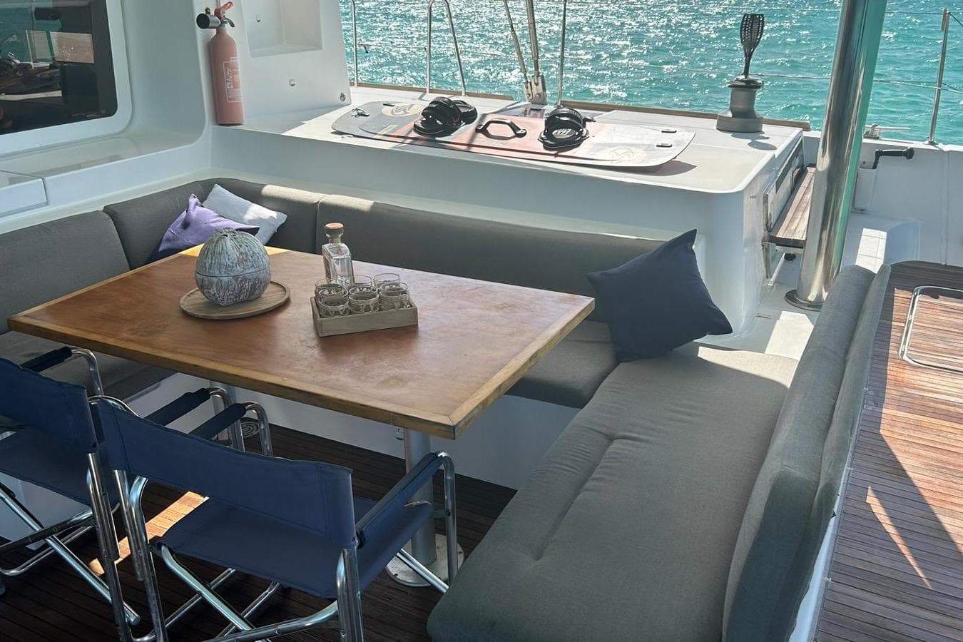 Luxurious Lagoon 52F 2012 yacht interior with cozy seating and ocean view.