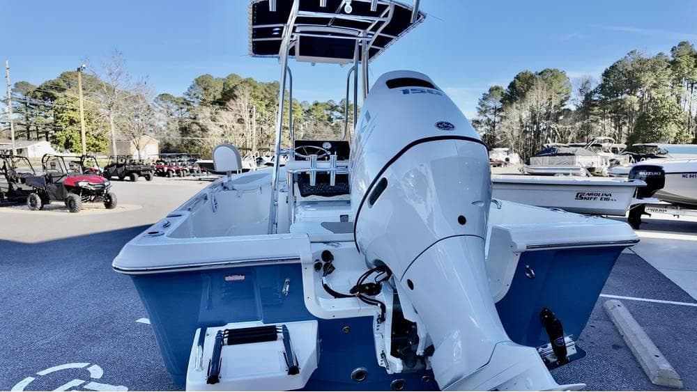 2025 Bulls Bay 2200 XS boat with outboard motor, parked outdoors.