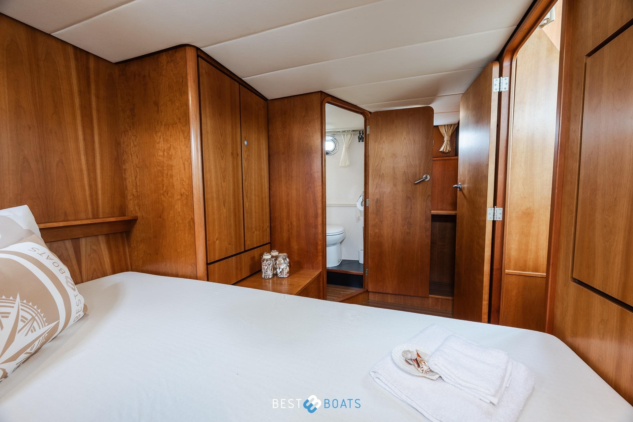 Luxurious cabin interior of 2010 Linssen Grand Sturdy 34.9 AC yacht, featuring wood paneling.