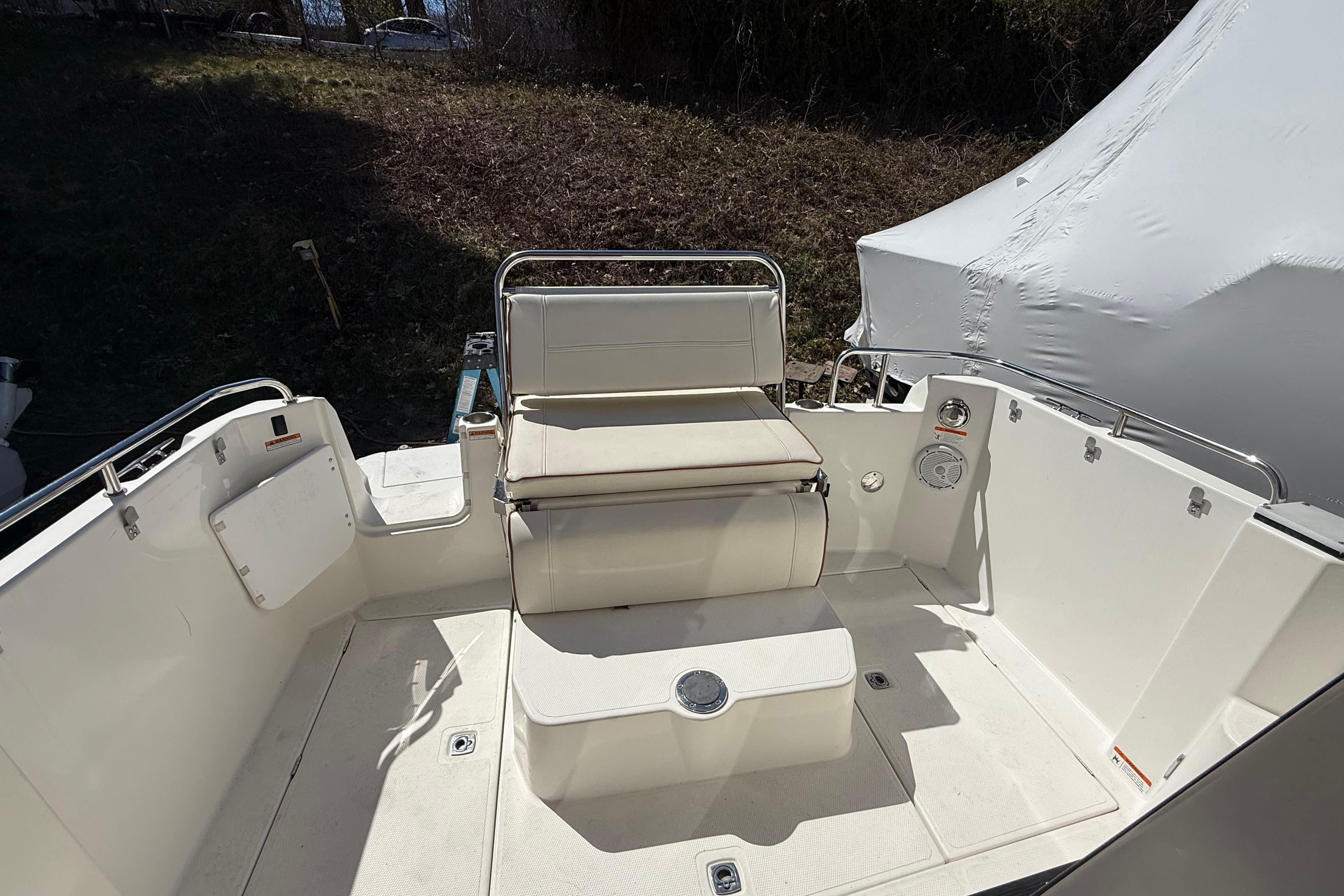 2016 Cutwater 24 boat interior with white seating and clean deck design.