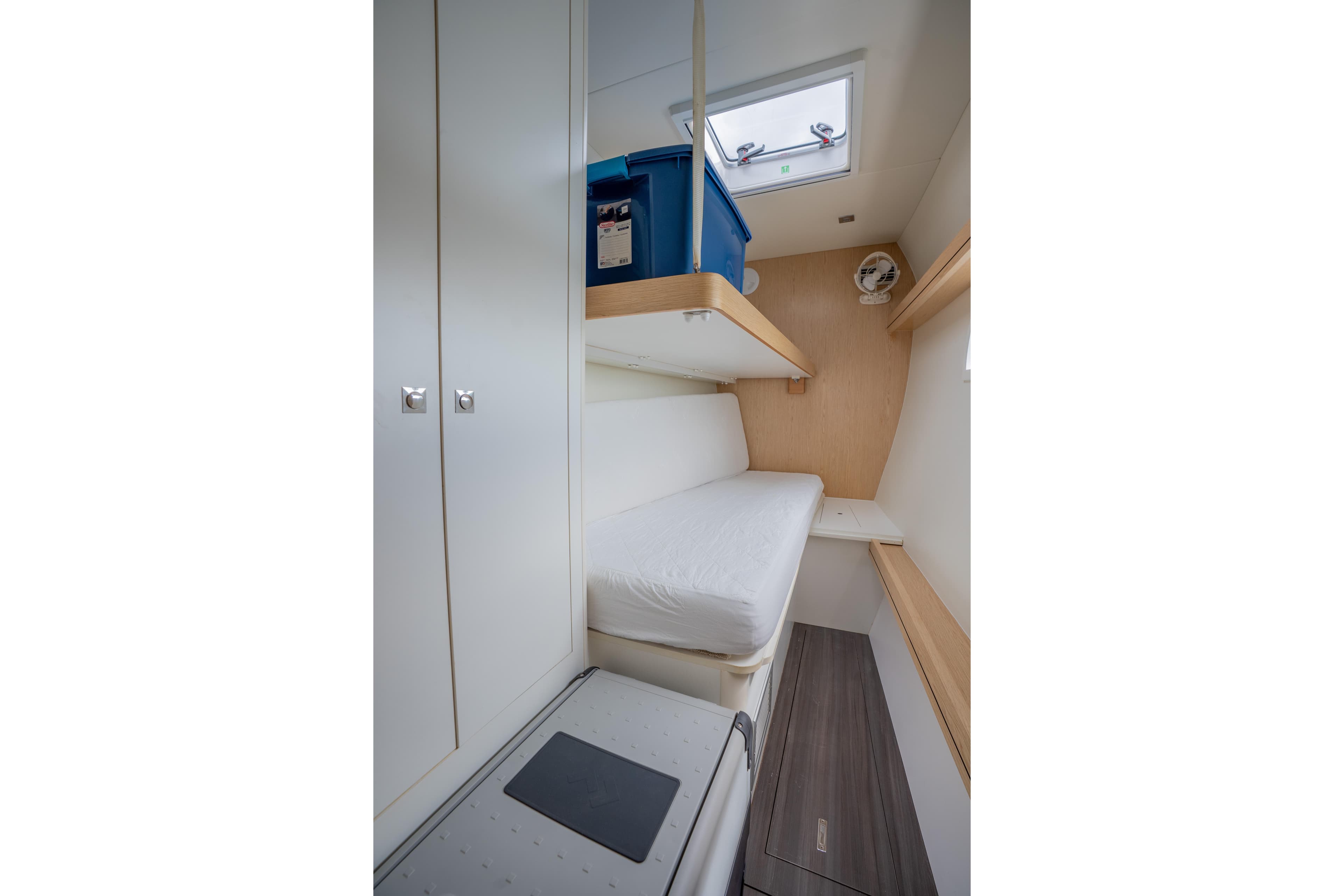2020 Outremer 51 yacht cabin interior with bed, storage, and skylight.