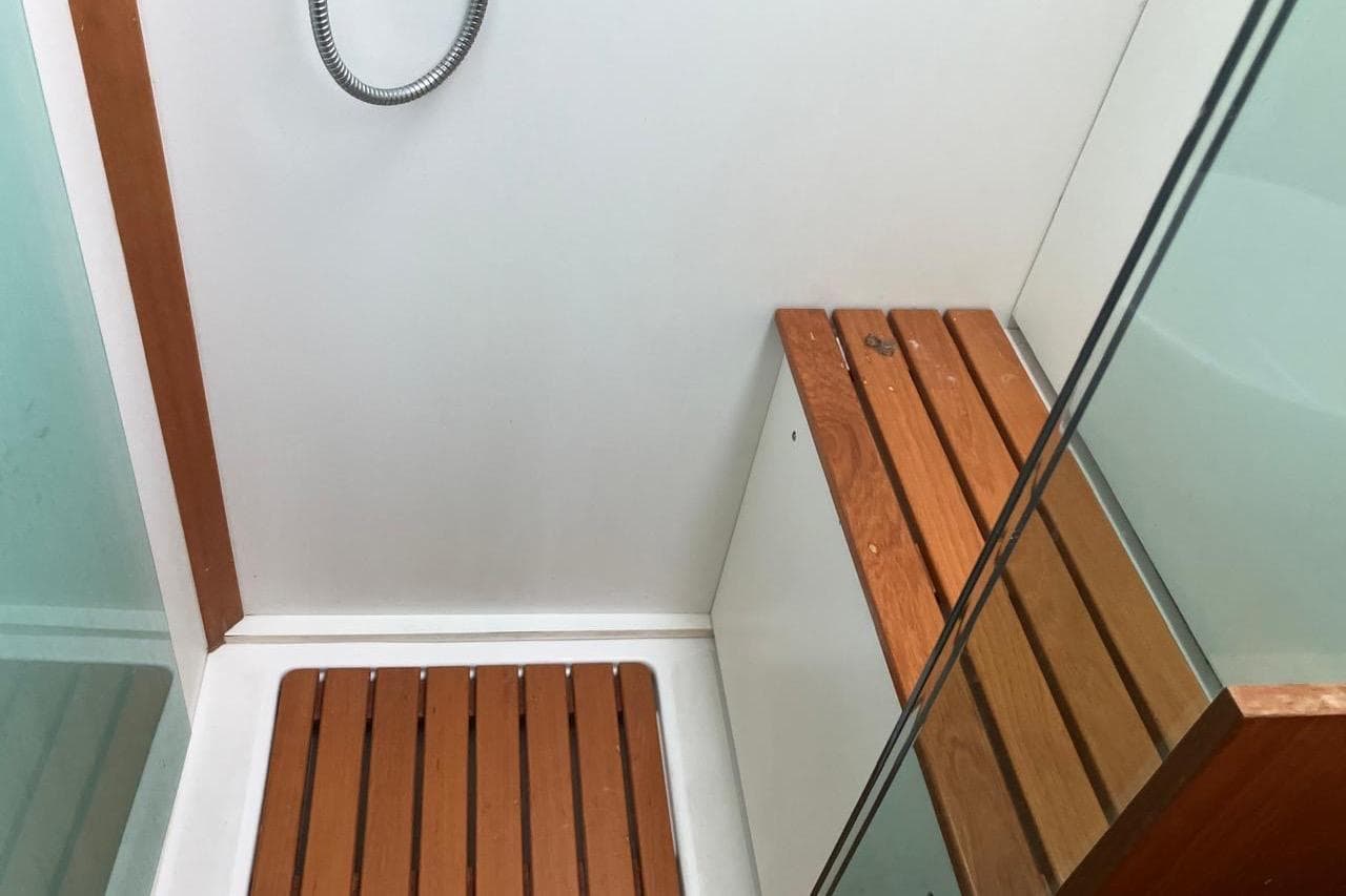 Shower area with wooden bench in 2011 Wauquiez Pilot Saloon 55 yacht.